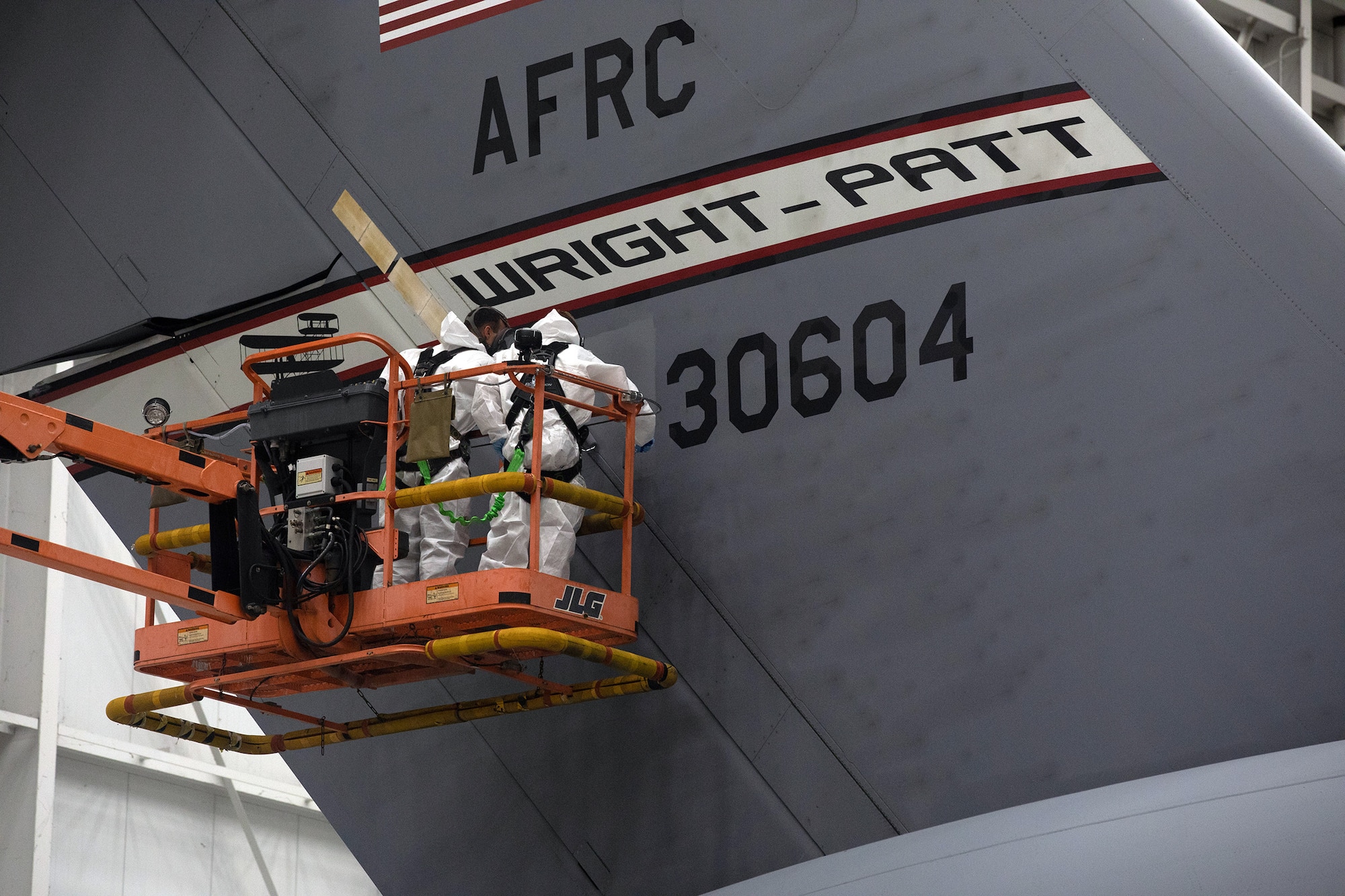 Staff Sgt. Charles Swaim and Senior Airman Clayton Langston, both aircraft structural maintenance technicians with the 445th Maintenance Squadron, spot paint a C-17 Globemaster III during the Oct. 6, 2019 unit training assembly.