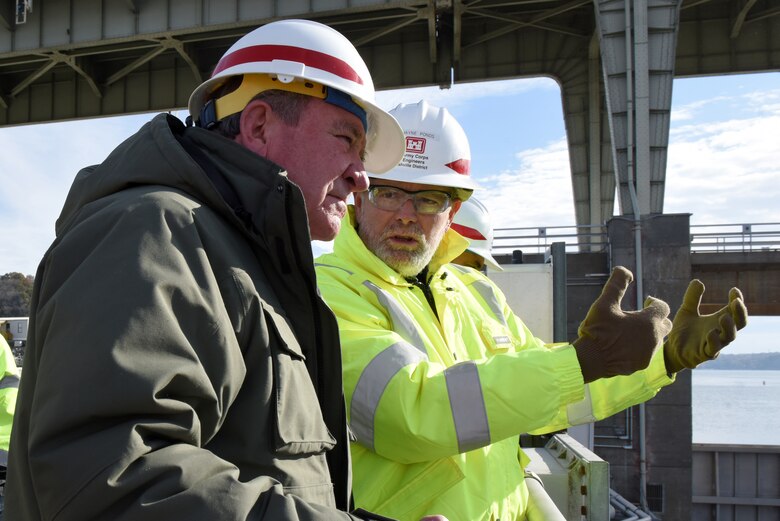 Dwayne Ponds (Right), U.S. Army Corps of Engineers Nashville District project geologist, explains the ongoing work to place concrete and construct a new navigation lock to R.D. James, assistant secretary of the Army for Civil Works, during a walking tour Nov. 14, 2019 at Chickamauga Lock on the Tennessee River in Chattanooga, Tenn. The Nashville District is constructing a new 110-foot by 600-foot navigation lock at the Tennessee Valley Authority project. (USACE photo by Lee Roberts)