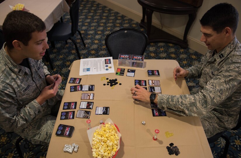 U.S. Air Force Capt. Nathaniel Flack, Department of Electrical and computer engineering student at the Air Force Institute of Technology and 1st Lt. Joseph Conger, Air Combat Command 17th Intelligence Squadron, challenge each other in a game of Battlespace Next at Joint Base Langley-Eustis, Virginia, Nov. 18, 2019. The game encourages creative tactical thinking and problem solving. (U.S. Air Force photo by Airman 1st Class Sarah Dowe)