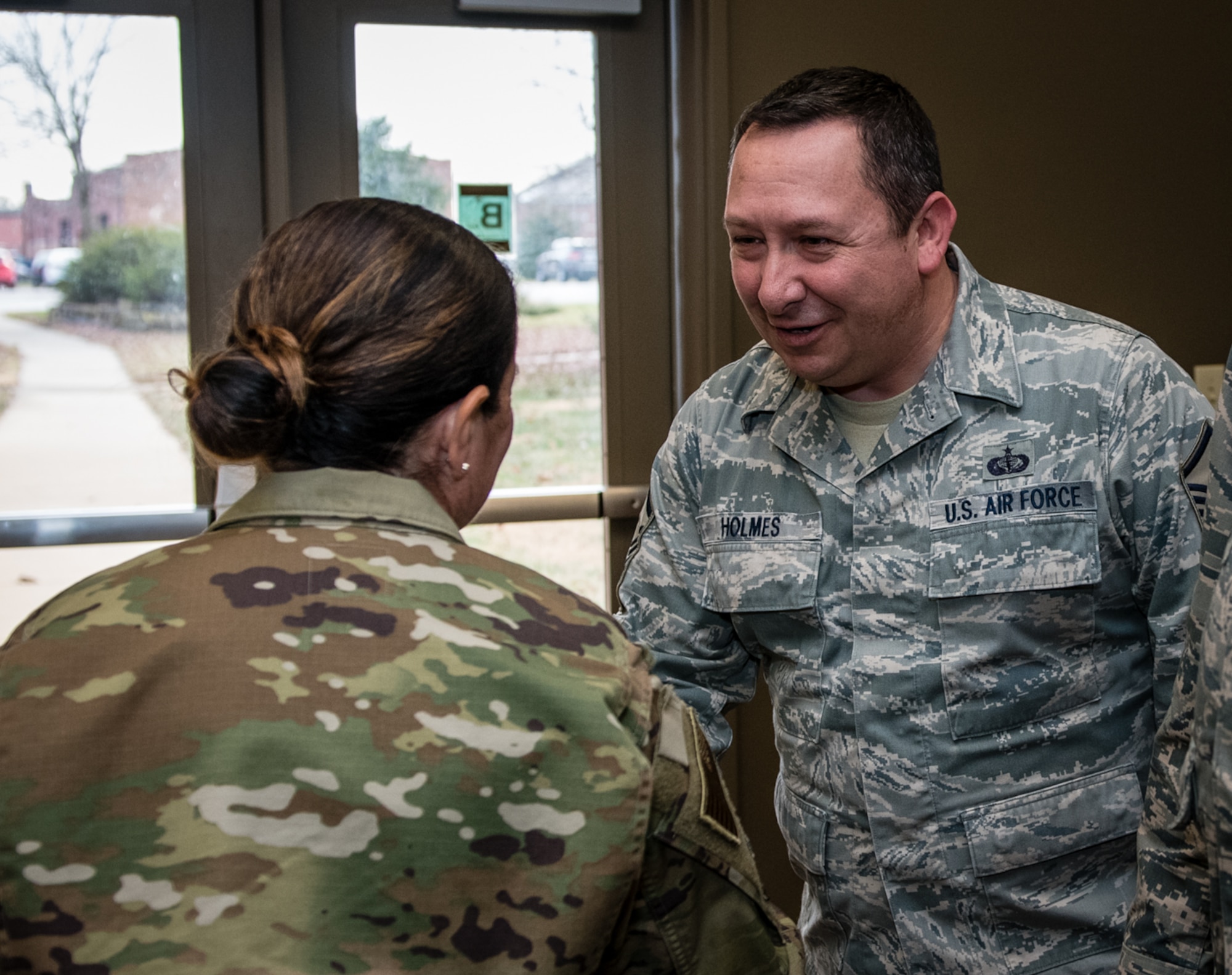 Retiring 932nd Force Support Squadron member, Master Sgt. Jeffery Holmes, is presented a coin by 932nd Command Chief Barbara Gilmore, Nov. 16, 2019, Scott Air Force Base, Illinois. Holmes looks forward to more time and birthdays with family and friends.  (U.S. Air Force photo by Master Sgt. Christopher Parr)