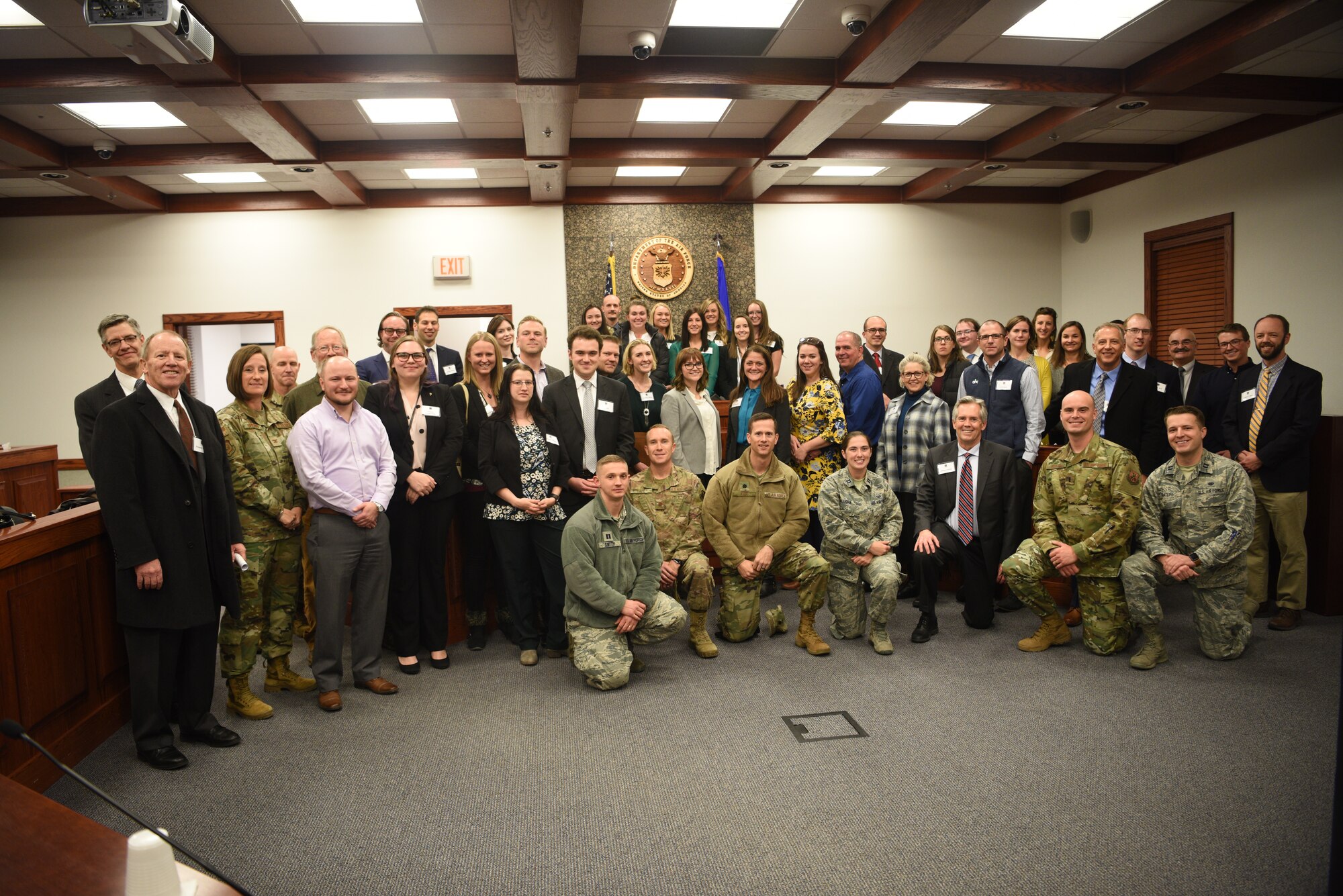 A visiting group from the local chapter of the American Inns of Court poses with members of the 90th Missile Wing's judge advocates during a tour on base Nov. 7, 2019, on F. E. Warren Air Force Base, Wyo. Members of the Inns of Court included justices from the state supreme court, law professors from the University of Wyoming, and local attorneys. The tour was intended to promote stronger relationships between the base legal professionals and their local civilian counterparts. (U.S. Air Force photo by Glenn S. Robertson).