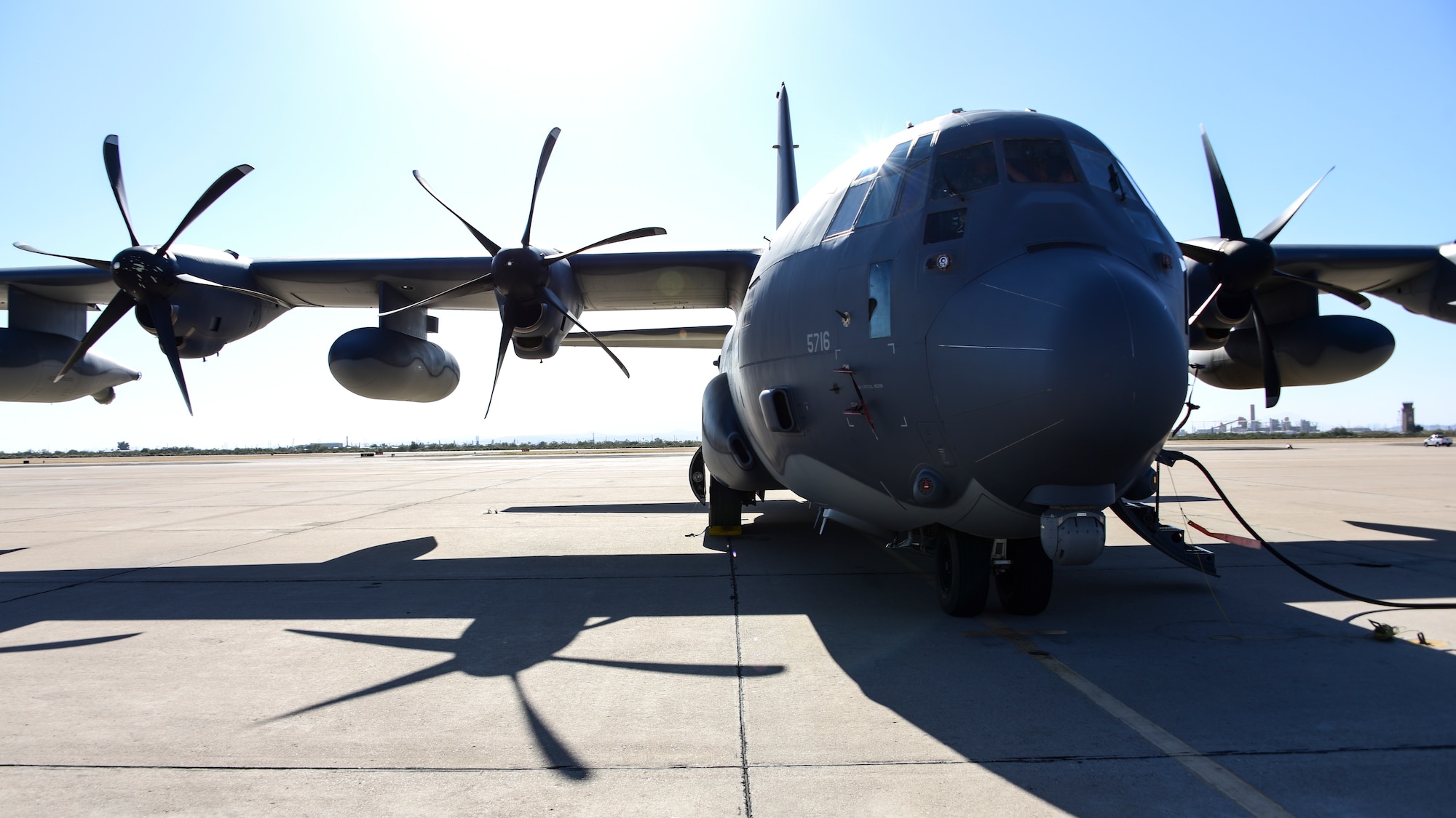 An HC-130J Combat King 2 sits on a flight line at Davis-Monthan.