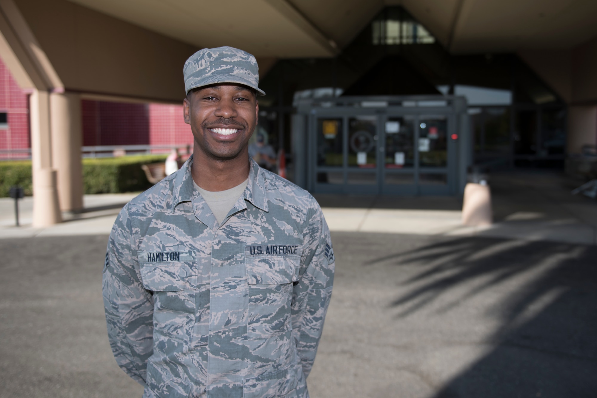 U.S. Air Force Senior Airman Andre Hamilton, 60th Medical Support Squadron health services management technician, stands in front of David Grant USAF Medical Center Nov. 19, 2019, at Travis Air Force Base, California. Hamilton was recognized as the Warrior of the Week for Nov. 17-23. The program highlights a Travis Airman for his or her outstanding performance. (U.S. Air Force photo by Airman 1st Class Cameron Otte)
