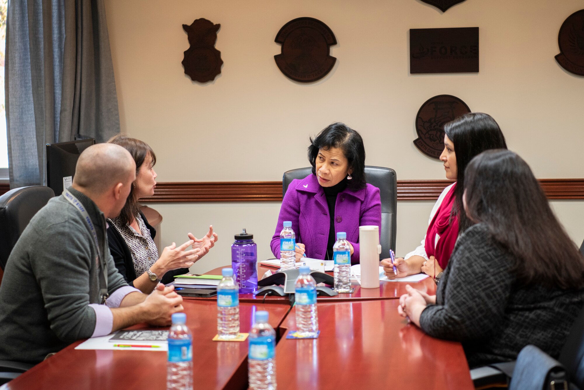Sharene Brown, spouse of Gen. CQ Brown, Jr. (center), Pacific Air Forces commander, and Stephanie Johnson, spouse of Chief Master Sgt. Anthony Johnson, PACAF command chief, meet with school liaisons on Nov. 14, 2019, at Yokota Air Base, Japan.