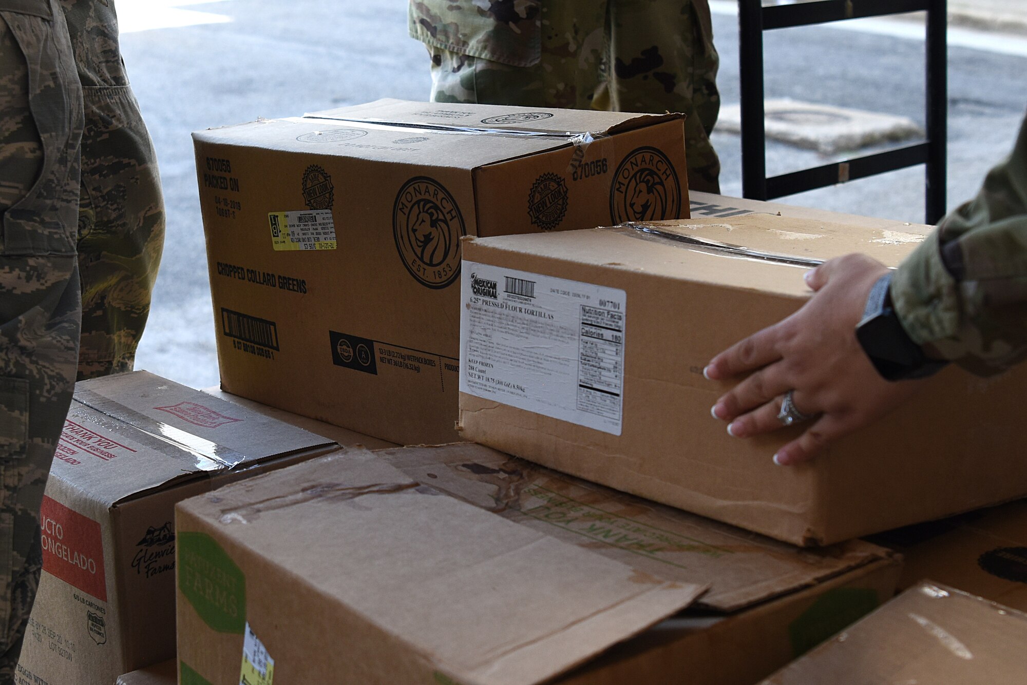Airmen from the 81st Medical Group palletize food outside Keesler Medical Center at Keesler Air Force Base, Mississippi, Nov. 18, 2019. Team Keesler was able to salvage and donate approximately 3,000 pounds of food to local food banks from a transit aircraft en route to Honduras, which landed at Keesler due to maintenance issues. (U.S. Air Force photo by Senior Airman Suzie Plotnikov)