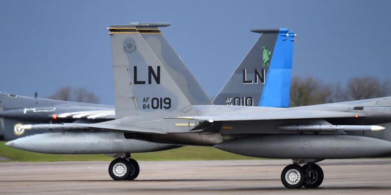 F-15C Eagles assigned to the 493rd Fighter Squadron taxi past each other on the flightline in support of exercise Point Blank 19-8 at Royal Air Force Lakenheath, England, Nov. 14, 2019. The purpose of Point Blank is to exercise large force capabilities that incorporate current and future wartime scenarios. (U.S. Air Force photo by Airman 1st Class Madeline Herzog)