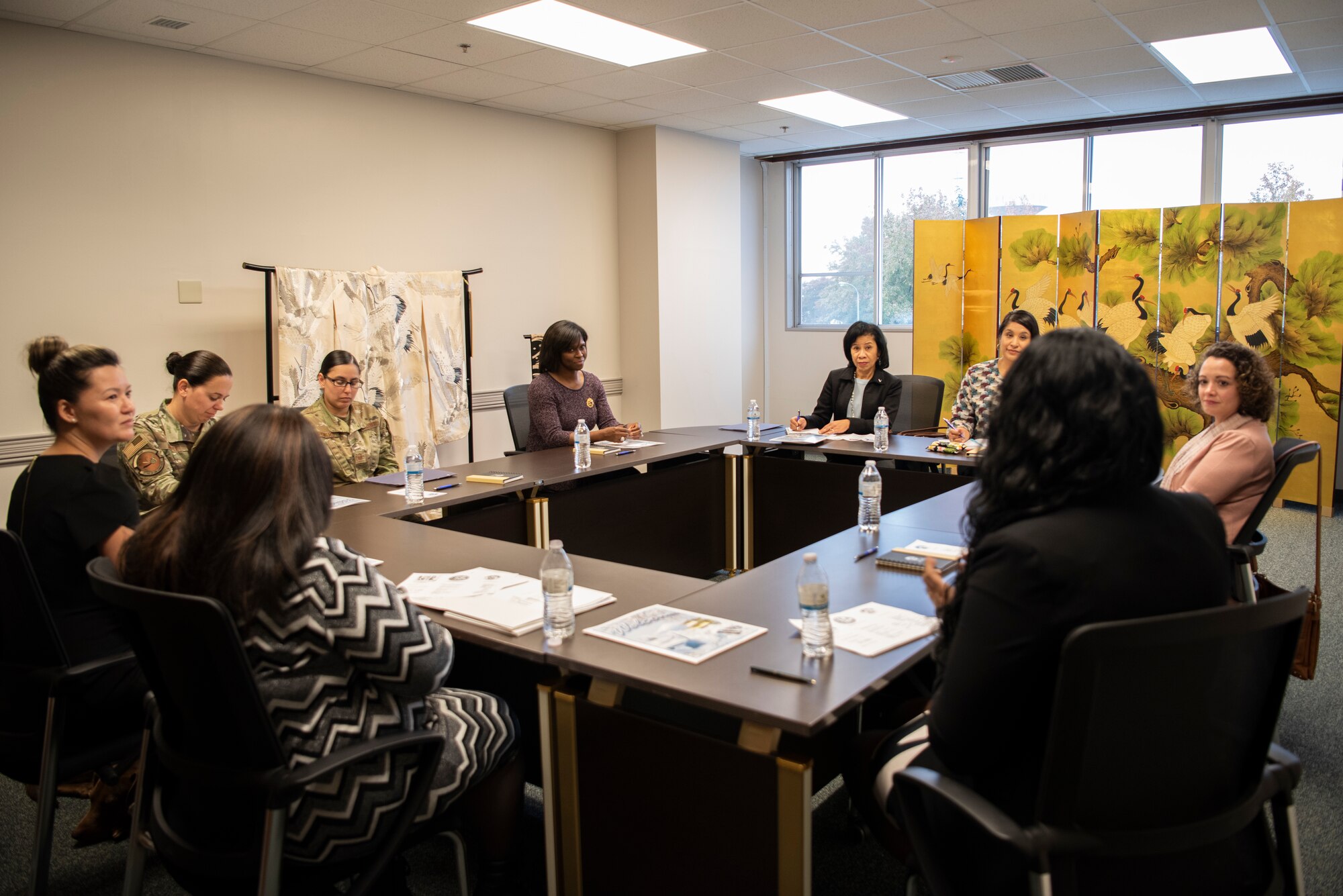 Sharene Brown, spouse of Gen. CQ Brown, Jr., Pacific Air Forces commander, and Stephanie Johnson, spouse of Chief Master Sgt. Anthony Johnson, PACAF command chief, meet with members of the Airman & Family Readiness Center on Nov. 14, 2019, at Yokota Air Base, Japan.