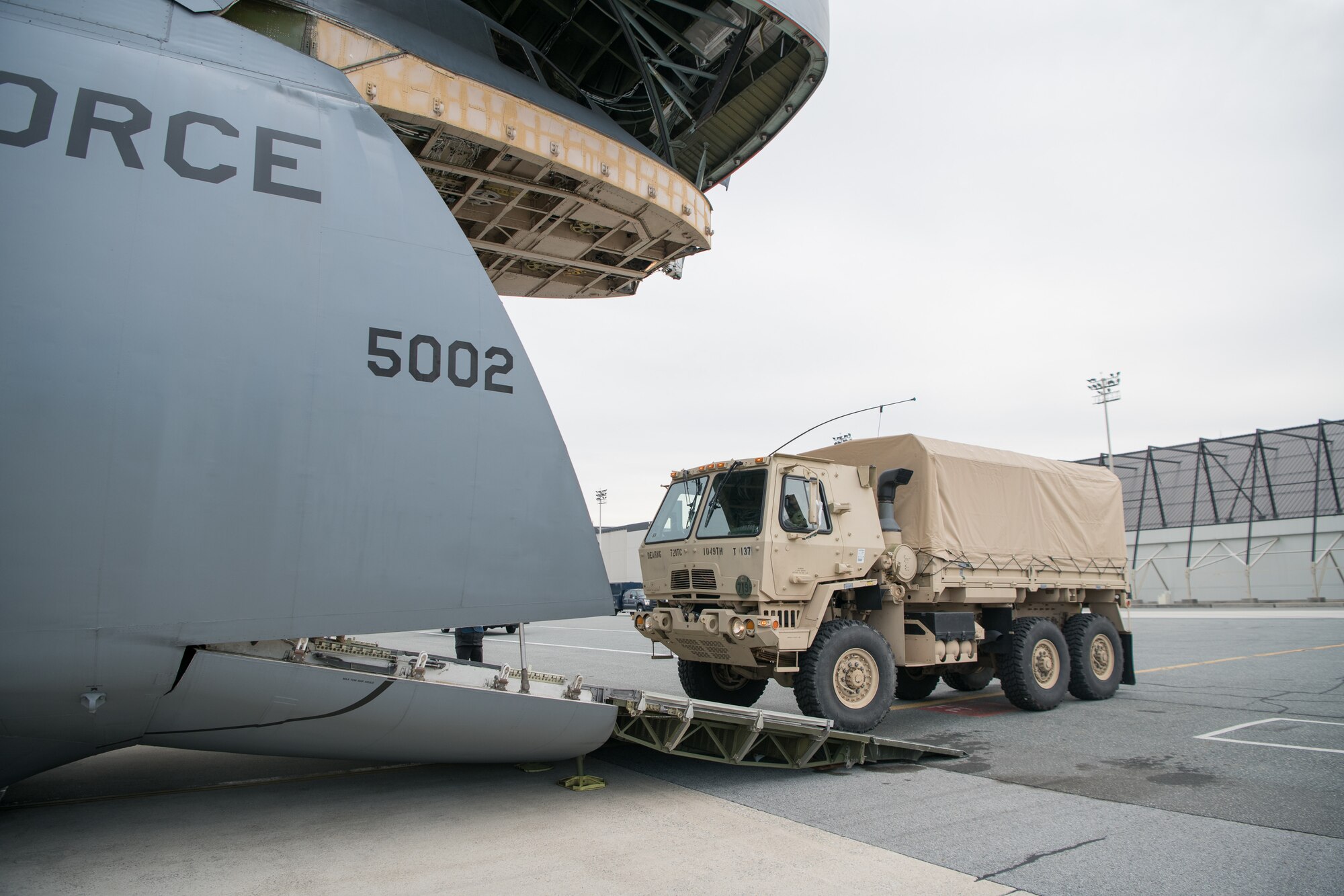 Vehicles from the 72nd Troop Command in New Castle, Del., are loaded onto a C-5M Super Galaxy during the Dover Operational Readiness for a Multi-domain Agile Response Exercise Nov. 14, 2019, at Dover Air Force Base, Del. The exercise included a simulated mass troop deployment to aid citizens following a natural disaster. (U.S. Air Force photo by Mauricio Campino)