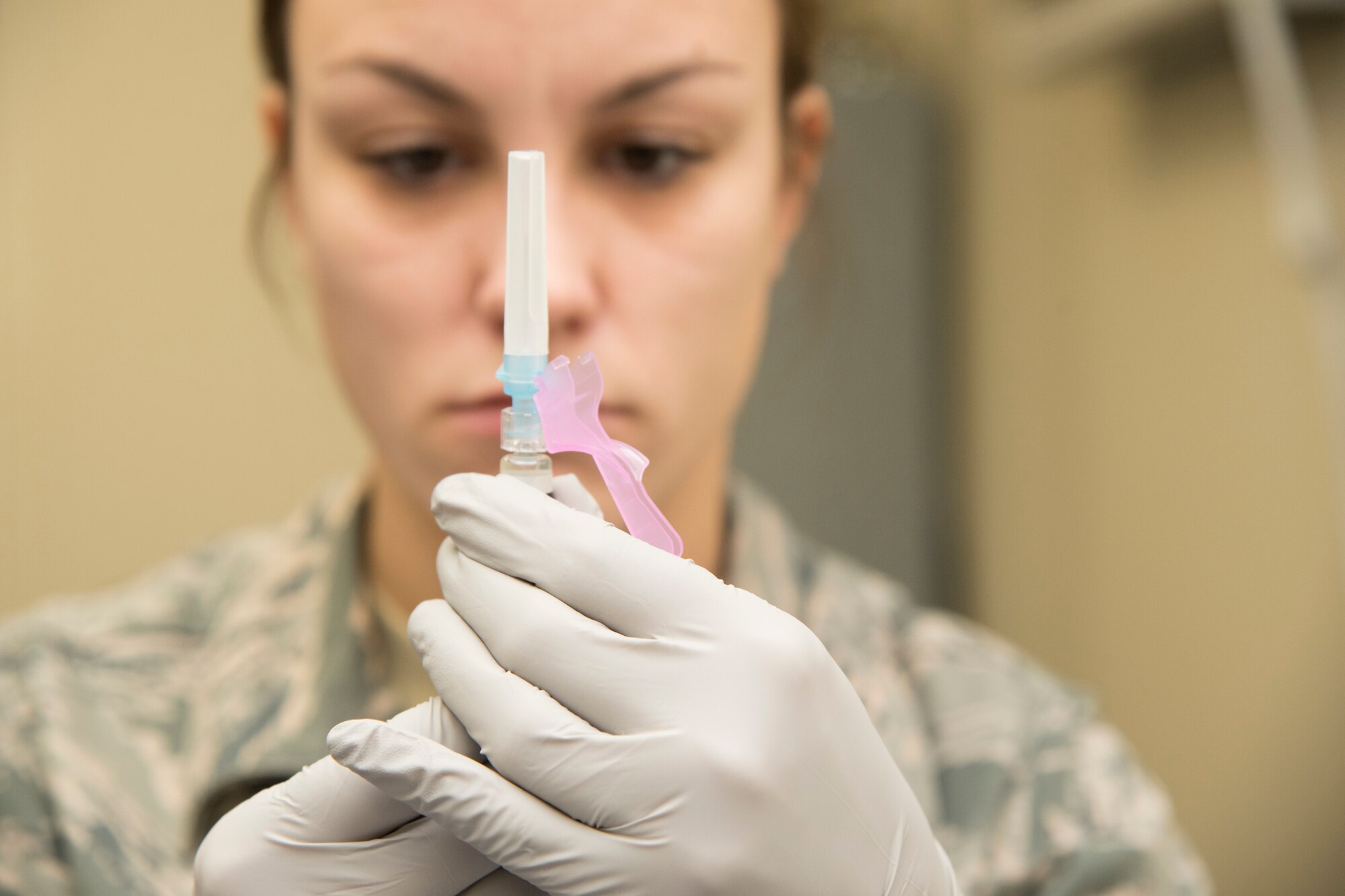 U.S. Air Force Staff Sgt. Jamie Cristinzio, aerospace medical technician, 141 Air Refueling Squadron, prepares a flu shot at Joint Base McGuire-Dix-Lakehurst, New Jersey, Nov. 15, 2019. All wing members are required to receive their flu vaccine as a part of their individual medical readiness. (U.S. Air National Guard photo by Airman 1st Class Andrea A. S. Williamson)