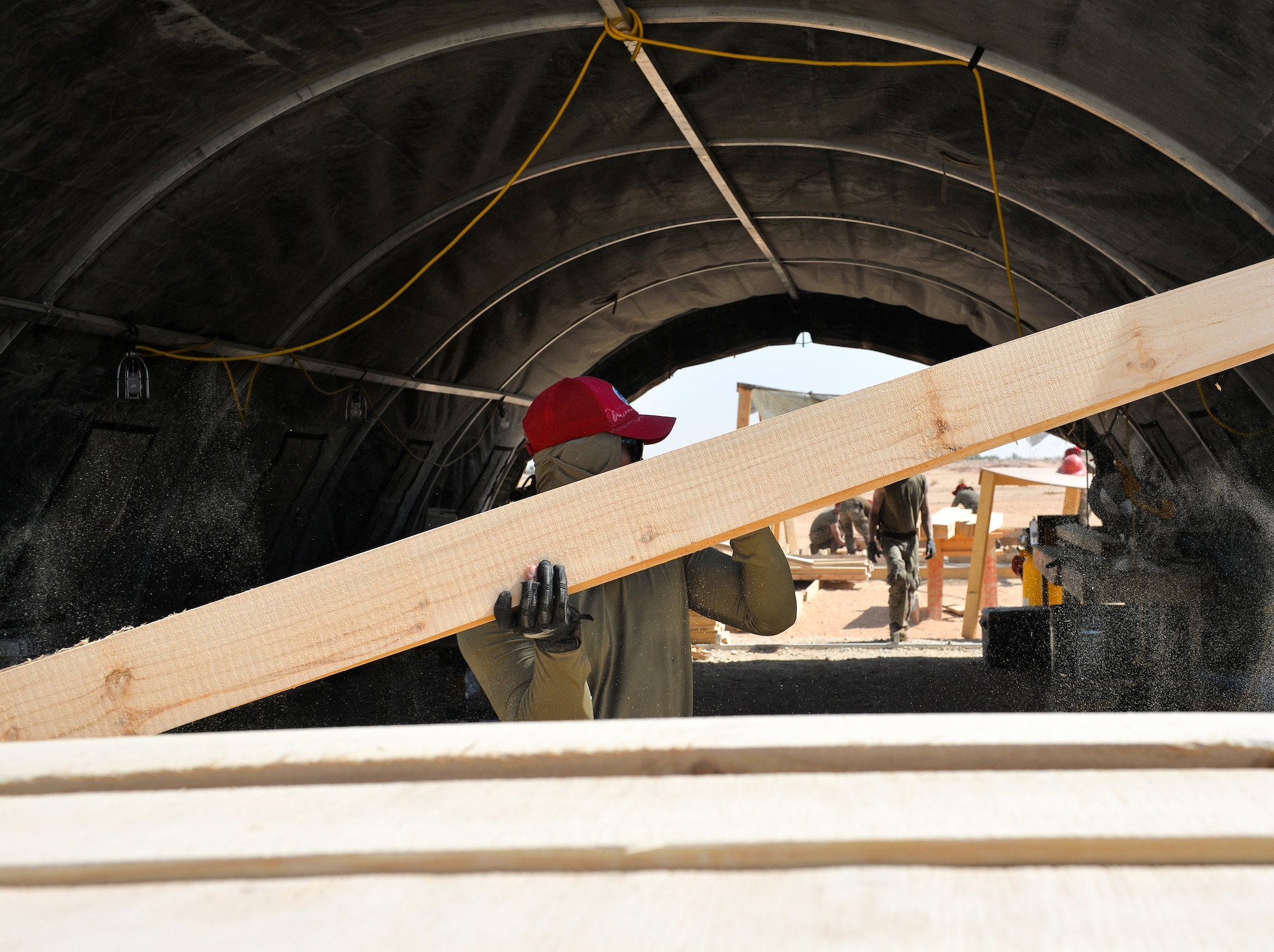 U.S. Air Force Airmen with the 1st Expeditionary Civil Engineering Group, build floor structures for tents at Prince Sultan Air Base (PSAB), Kingdom of Saudi Arabia (KSA), October 16, 2019.