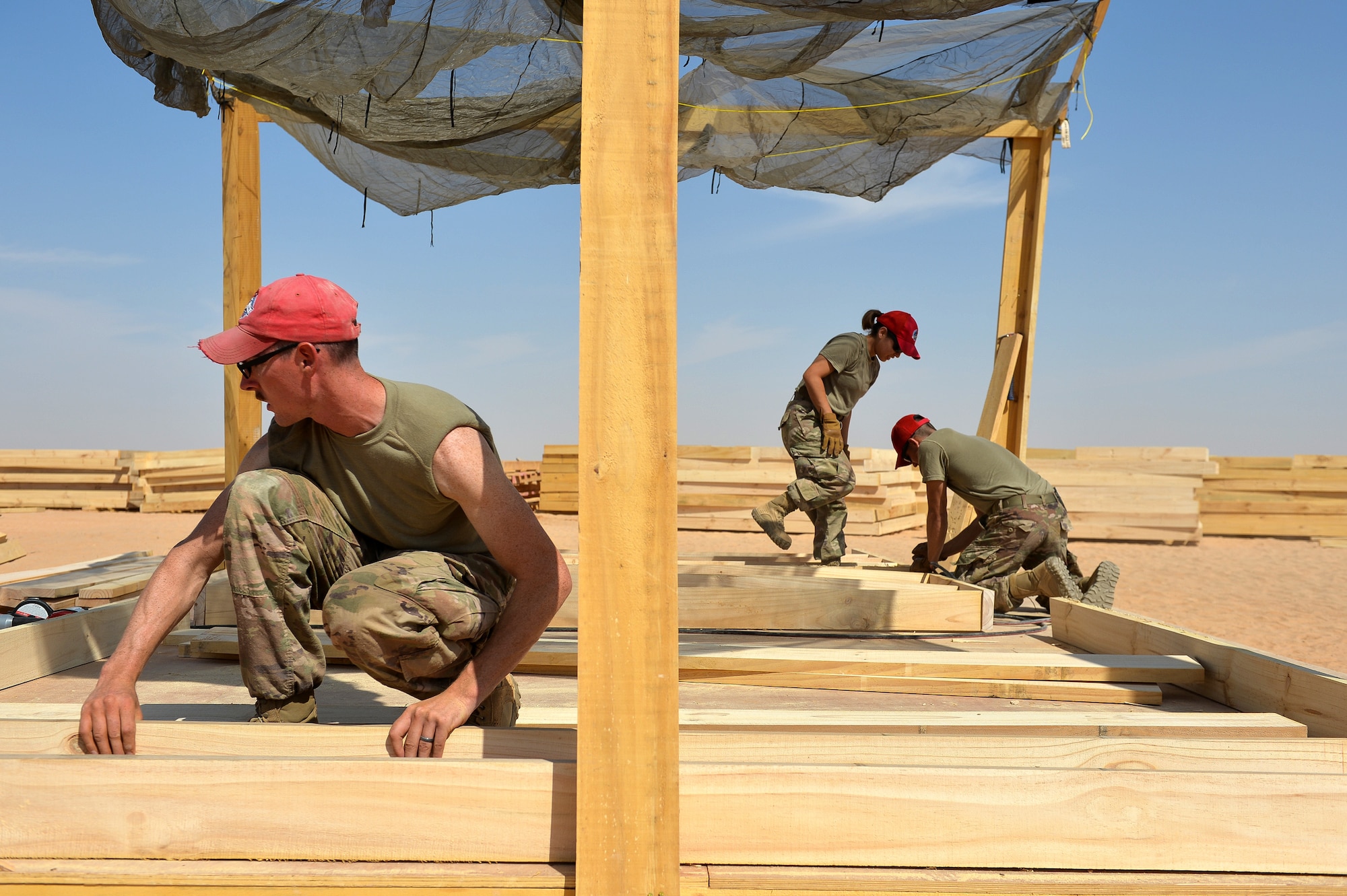U.S. Air Force Airmen with the 1st Expeditionary Civil Engineering Group, build floor structures for tents at Prince Sultan Air Base (PSAB), Kingdom of Saudi Arabia, October 16, 2019.