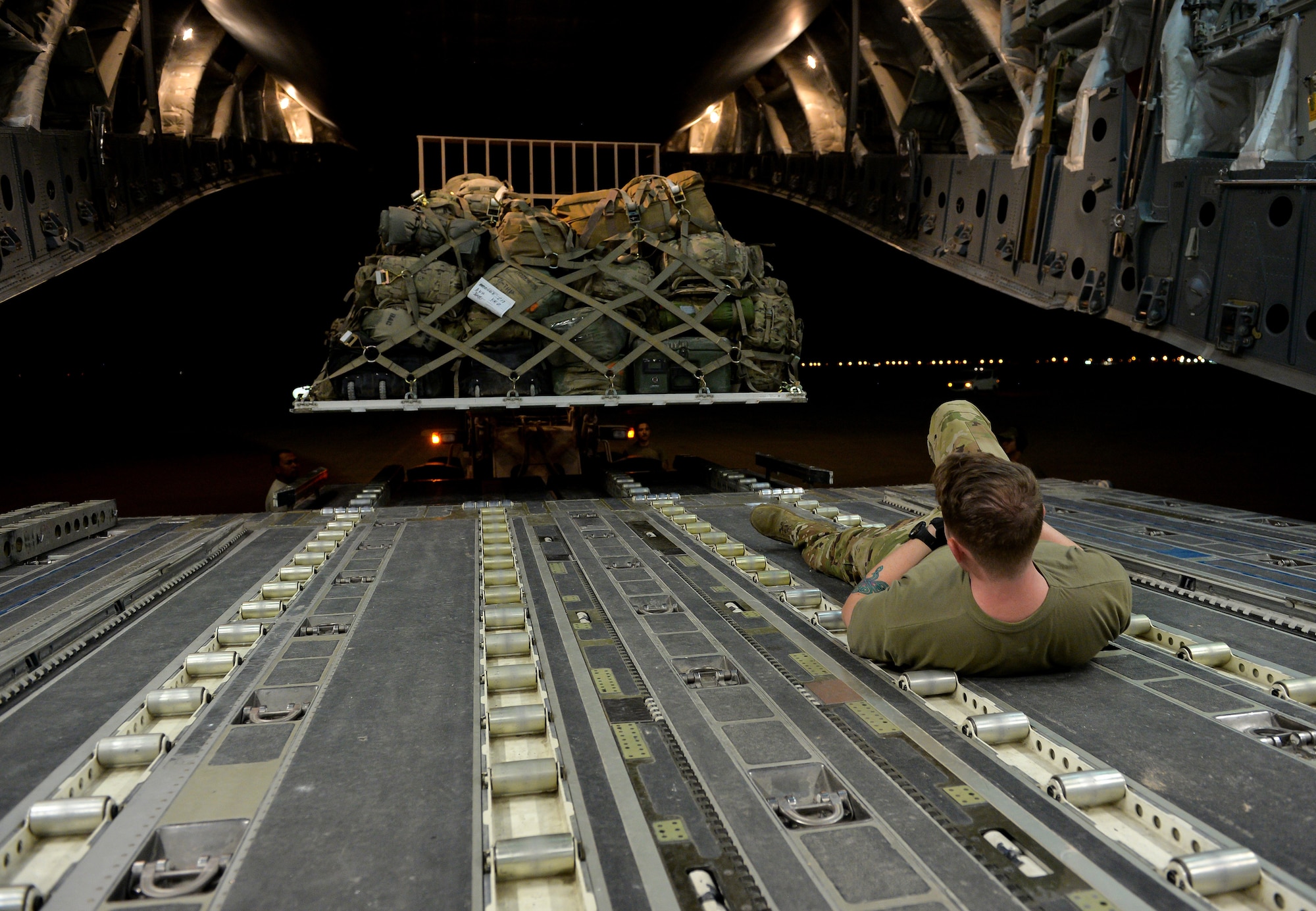 U.S. Air Force Aerial Transportation Specialists with the 378th Aerial Expeditionary Squadron, unload cargo from the back of a C-17 Globemaster III arriving at Prince Sultan Air Base (PSAB), Kingdom of Saudi Arabia (KSA), October  23, 2109.