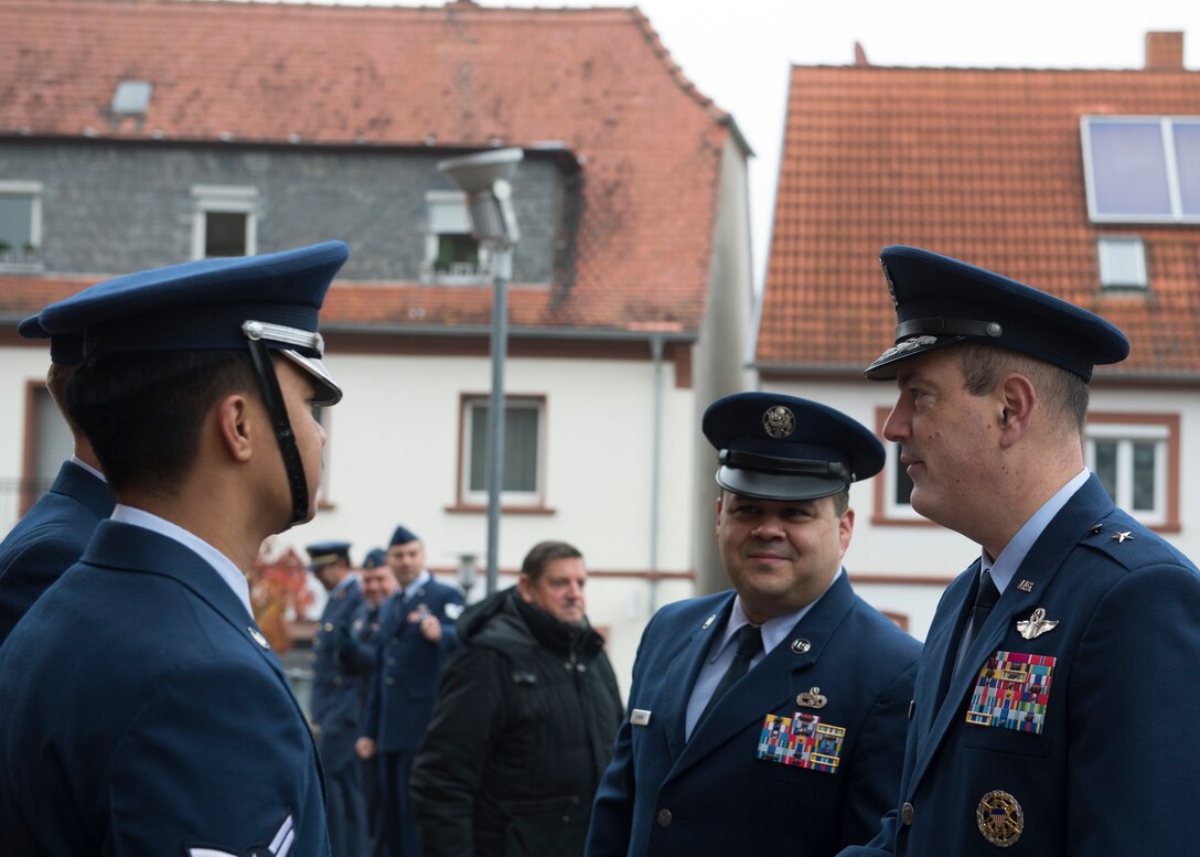 .S. Air Force Brig. Gen. Mark R. August, 86th Airlift Wing commander, and U.S. Air Force Chief Master Sgt. Ernesto J. Rendon, 86th AW command chief, meet with members of the Ramstein Air Base Honor Guard during Ramstein-Miesenbach’s National Day of Mourning Ceremony, Nov. 17, 2019.
