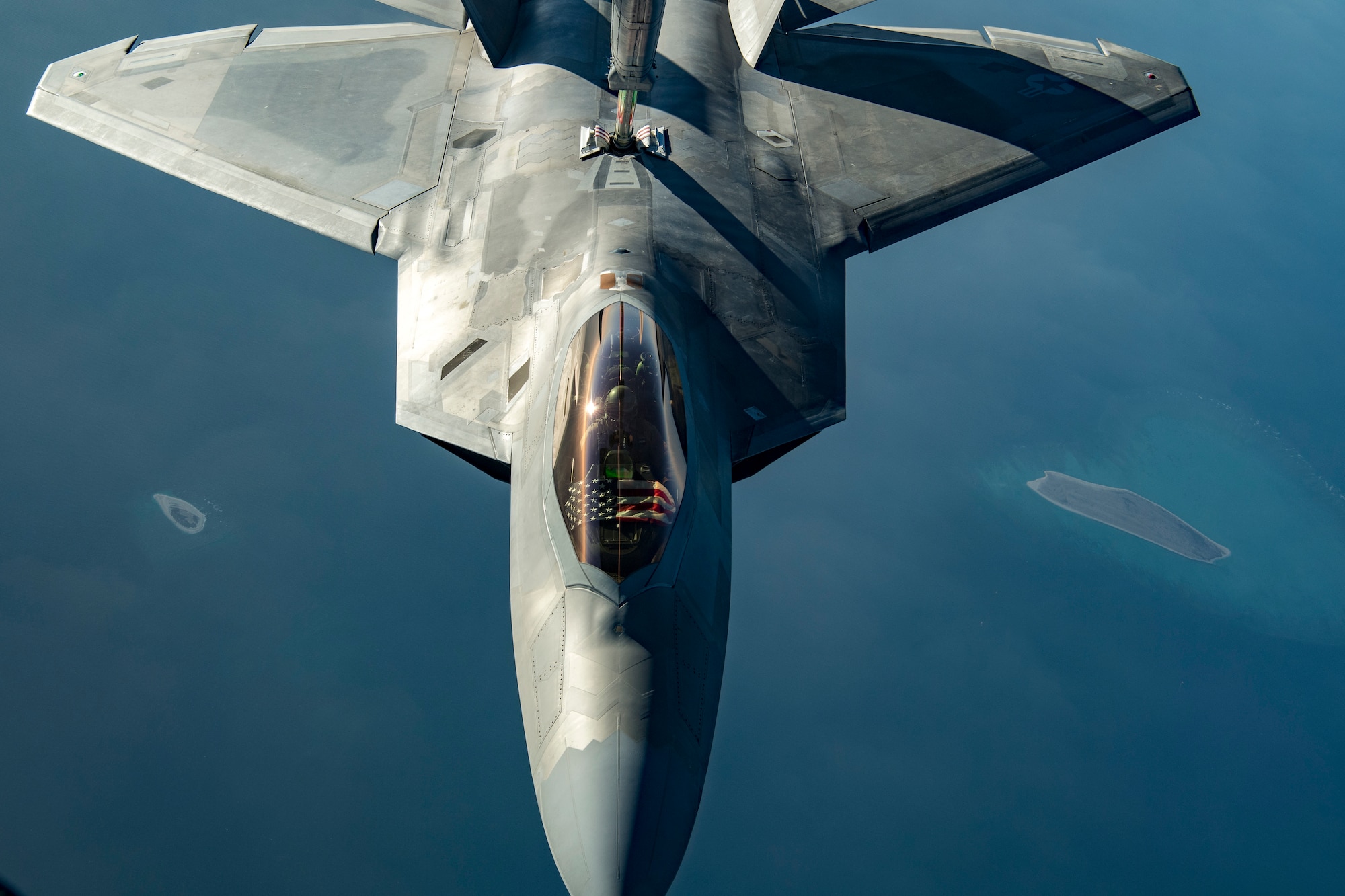 A United States Air Force F-22 Raptor receives fuel via aerial refueling from a KC-10 Extender over the Arabian Gulf, Nov. 1, 2019. The combination of aerodynamic design and thrust allows the F-22 to cruise at supersonic airspeeds without using afterburner, a characteristic known as supercruise.