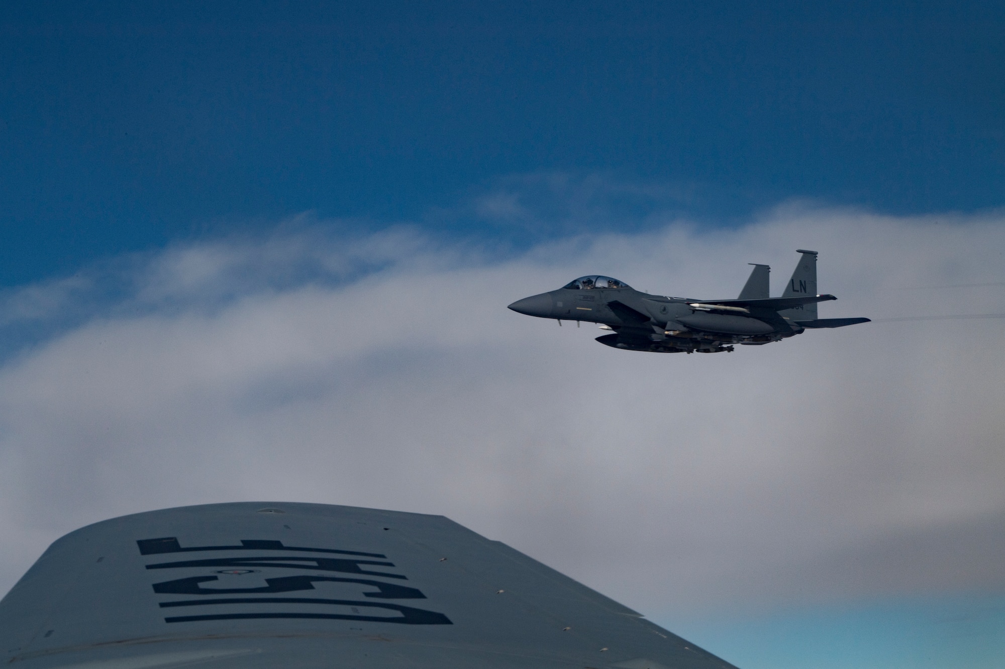 A U.S. Air Force F-15 Strike Eagle flies beside A U.S. Air Force KC-135 Stratotanker over northern Iraq, Nov. 6, 2019.