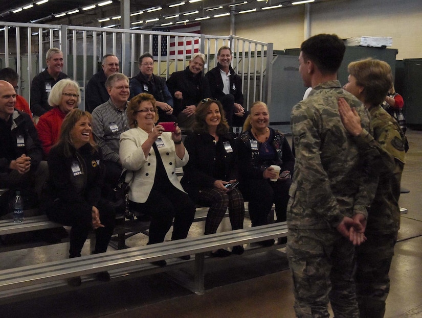 Airman 1st Class Noah Etienne, 87th Logistics Readiness Squadron Logistics Plans apprentice, is recognized by Gen. Maryanne Miller, Air Mobility Command commander, in front of AMC civic leaders at Joint Base McGuire-Dix-Lakehurst, N.J., Nov. 6, 2019, for being one of the youngest Airmen in the Air Force. Civic leaders were able to interact with Airmen and tour Joint Base MDL to better understand the mobility Airman and Rapid Global Mobility mission. (U.S. Air Force photo by Airman 1st Class Briana Cespedes)