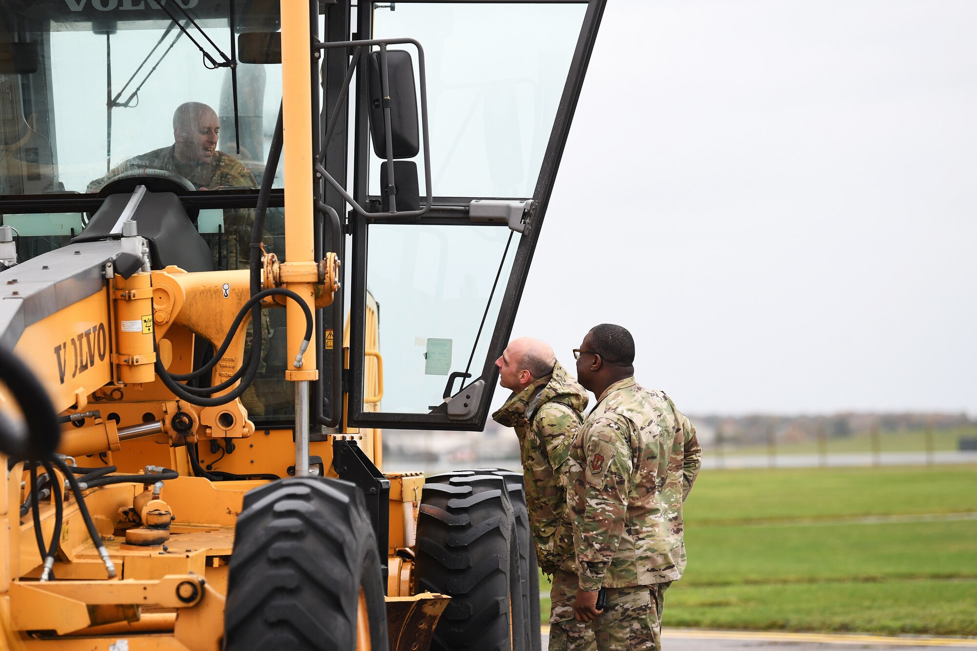U.S. Air Force Tech. Sgt. Frank Cavaliere, 48th Civil Engineer Squadron NCO in charge of heavy equipment, speaks to 48th CES leadership during an event displaying the snow and ice removal fleet at Royal Air Force Lakenheath, England, Nov. 15, 2019. The 48th CES operates a fleet of 12 variations of multi-purpose snow plow machines to support the installation during inclement weather. (U.S. Air Force photo by Senior Airman Shanice Williams-Jones)