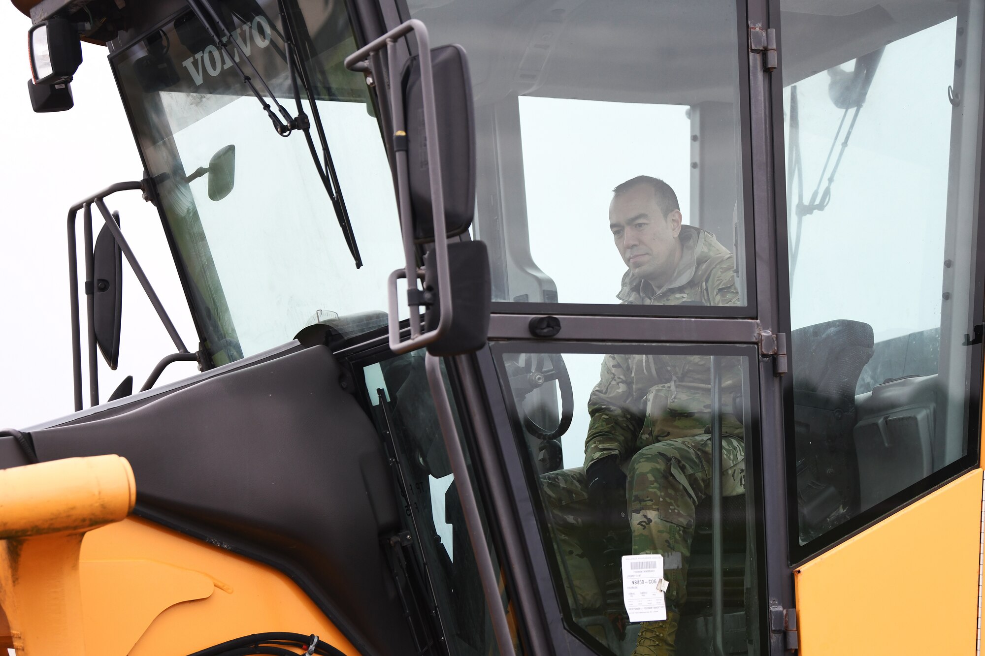 48th Civil Engineer Squadron leadership examines a snow and ice removal vehicle during an event displaying the snow and ice removal fleet at Royal Air Force Lakenheath, England, Nov. 15, 2019. The 48th CES operates a fleet of 12 variations of multi-purpose snow plow machines to support the installation during inclement weather.   (U.S. Air Force photo by Senior Airman Shanice Williams-Jones)