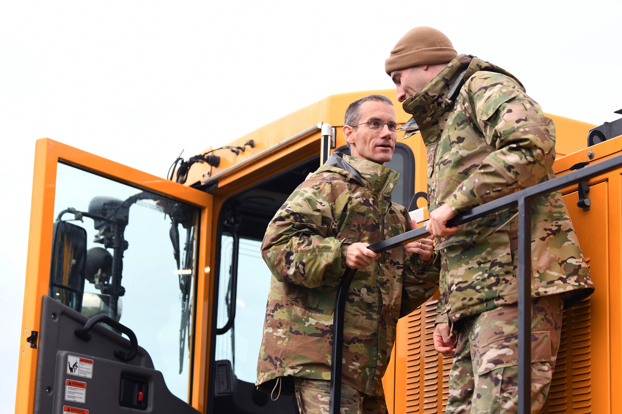 U.S. Air Force Col. Christopher Leonard, 48th Mission Support Group commander, speaks to 48th Civil Engineer Squadron leadership during an event displaying the snow and ice removal fleet at Royal Air Force Lakenheath, England, Nov. 15, 2019. The 48th CES operates a fleet of 12 variations of multi-purpose snow plow machines to support the installation during inclement weather. (U.S. Air Force photo by Senior Airman Shanice Williams-Jones)