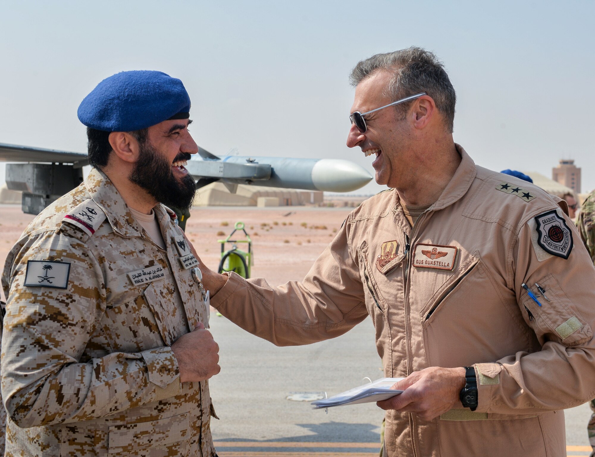 U.S. Air Force Lt. General Joesph Guastella, right, U.S. Air Forces Central Command commander, converses with Saudi Arabian Major General Khaled Al-Shablan, left, at Prince Sultan Air Base, Kingdom of Saudi Arabia, Nov. 11, 2019.