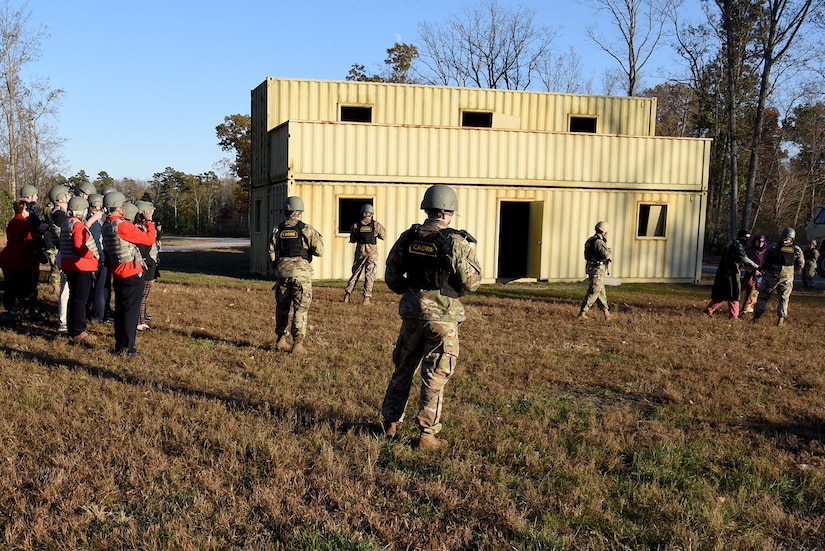 Air Mobility Command civic leaders watch asthe 421st Combat Training Squadron put on an urban operations demonstration at Home Station Training Lane West during their tour of the U.S. Air Force Expeditionary Operations School (EOS) in the U.S. Air Force Expeditionary Center, Nov. 6, 2019, at Joint Base McGuire-Dix- Lakehurst, New Jersey. The AMC civic leaders toured the EOS to see the training they provide and how they better prepare Airmen for deployments. (U.S. Air Force photo by Tech. Sgt. Ashley Hyatt)