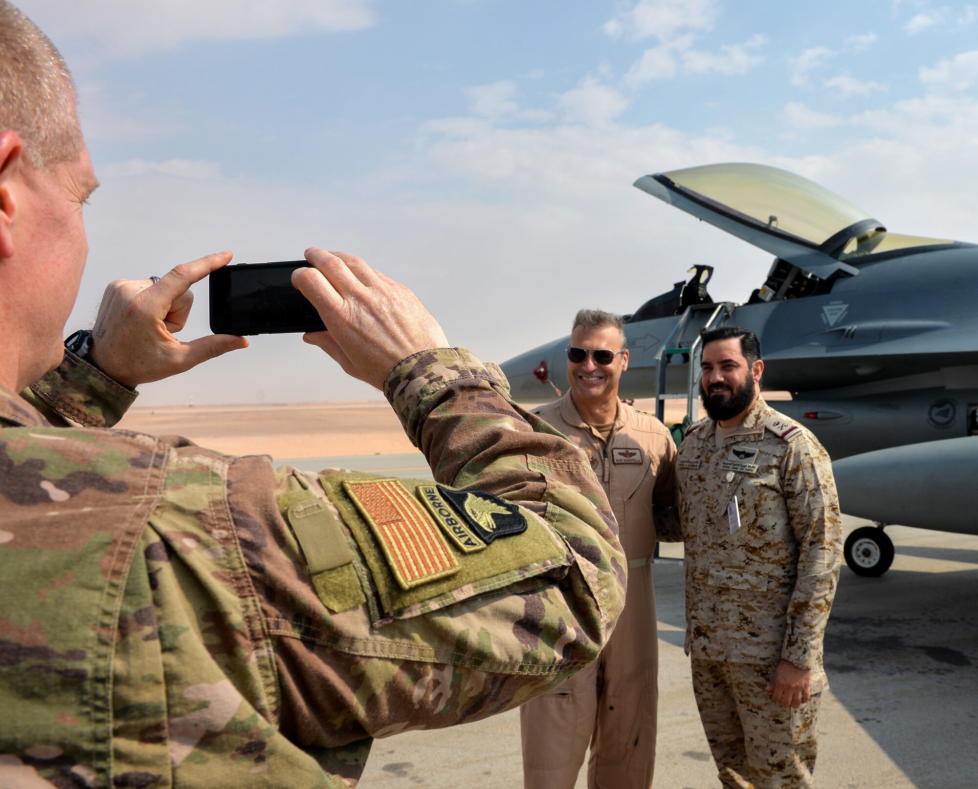 U.S. Air Force Lt. General Joesph Guastella, left, U.S. Air Forces Central Command commander, takes a picture with Saudi Arabian Major General Khaled Al-Shablan, right, at Prince Sultan Air Base, Kingdom of Saudi Arabia, Nov. 11, 2019.