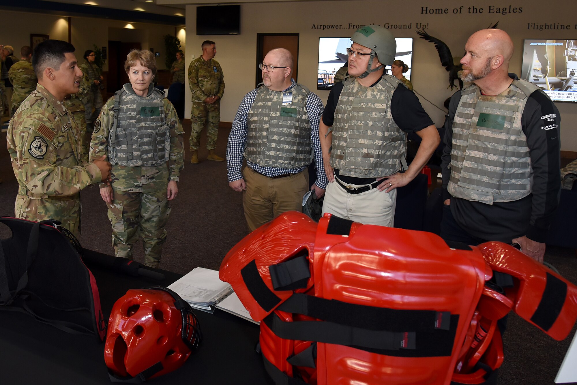 U.S. Air Force Staff Sgt. Jonathan Matute, Phoenix Raven Qualification Course (PRQC) instructor assigned to the 421st Combat Training Squadron, explains what students learn during PRQC to Gen. Maryanne Miller, commander of Air Mobility Command (AMC), and AMC civic leaders during their tour of the U.S. Air Force Expeditionary Operations School (EOS) in the U.S. Air Force Expeditionary Center, Nov. 6, 2019, at Joint Base McGuire-Dix- Lakehurst, New Jersey.  The AMC civic leaders toured the EOS to see the training they provide and how they better prepare Airmen for deployments. (U.S. Air Force photo by Tech. Sgt. Ashley Hyatt)