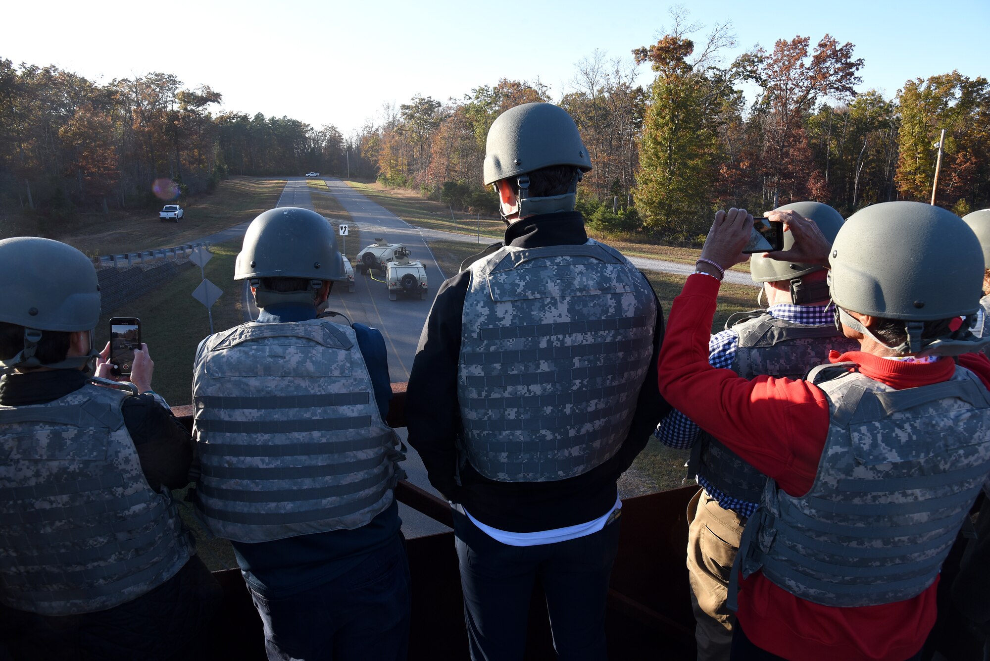 Air Mobility Command civic leaders watch asthe 421st Combat Training Squadron put on a mounted operations demonstration at Home Station Training Lane West during their tour of the U.S. Air Force Expeditionary Operations School (EOS) in the U.S. Air Force Expeditionary Center, Nov. 6, 2019, at Joint Base McGuire-Dix- Lakehurst, New Jersey. The AMC civic leaders toured the EOS to see the training they provide and how they better prepare Airmen for deployments. (U.S. Air Force photo by Tech. Sgt. Ashley Hyatt)