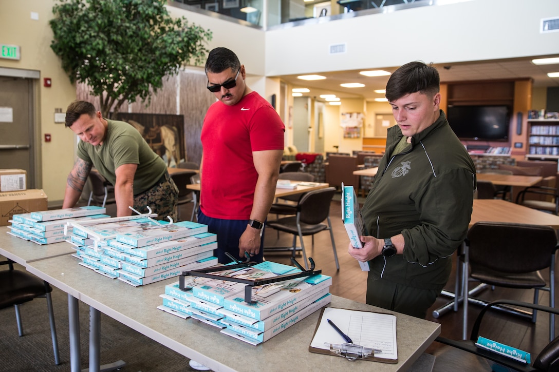 April Mitchell, entrepreneur, speaks with Marines at Wounded Warriors Battalion - West on Marine Corps Base Camp Pendleton, California, Nov. 15, 2019. Mitchell, a military spouse, created a new door hook in hopes of giving individuals with less mobility more independence. Mitchell is a native of Lake Mills, Wisconsin.