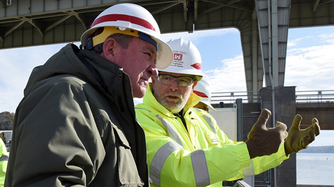 Dwayne Ponds (Right), U.S. Army Corps of Engineers Nashville District project geologist, explains the ongoing work to place concrete and construct a new navigation lock to R.D. James, assistant secretary of the Army for Civil Works, during a walking tour Nov. 14, 2019 at Chickamauga Lock on the Tennessee River in Chattanooga, Tenn. The Nashville District is constructing a new 110-foot by 600-foot navigation lock at the Tennessee Valley Authority project. (USACE photo by Lee Roberts)