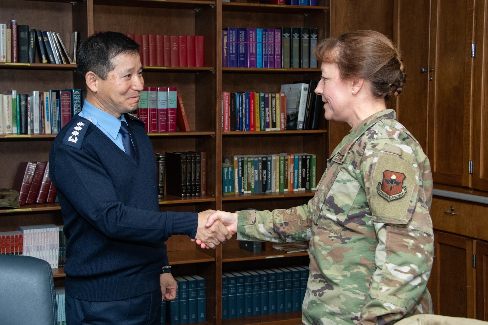 Col. Terri Jones, the Eaker Center for Leadership Development commander, greets Chaplain Kwang-Nam Na, Republic of Korea Air Force Chief of Chaplains, before providing an Eaker Center mission brief during a visit to Air University Nov. 14, 2019, at Maxwell, Air Force Base, Alabama. The visit was meant to showcase the commitment both parties have toward strengthening their existing alliance.