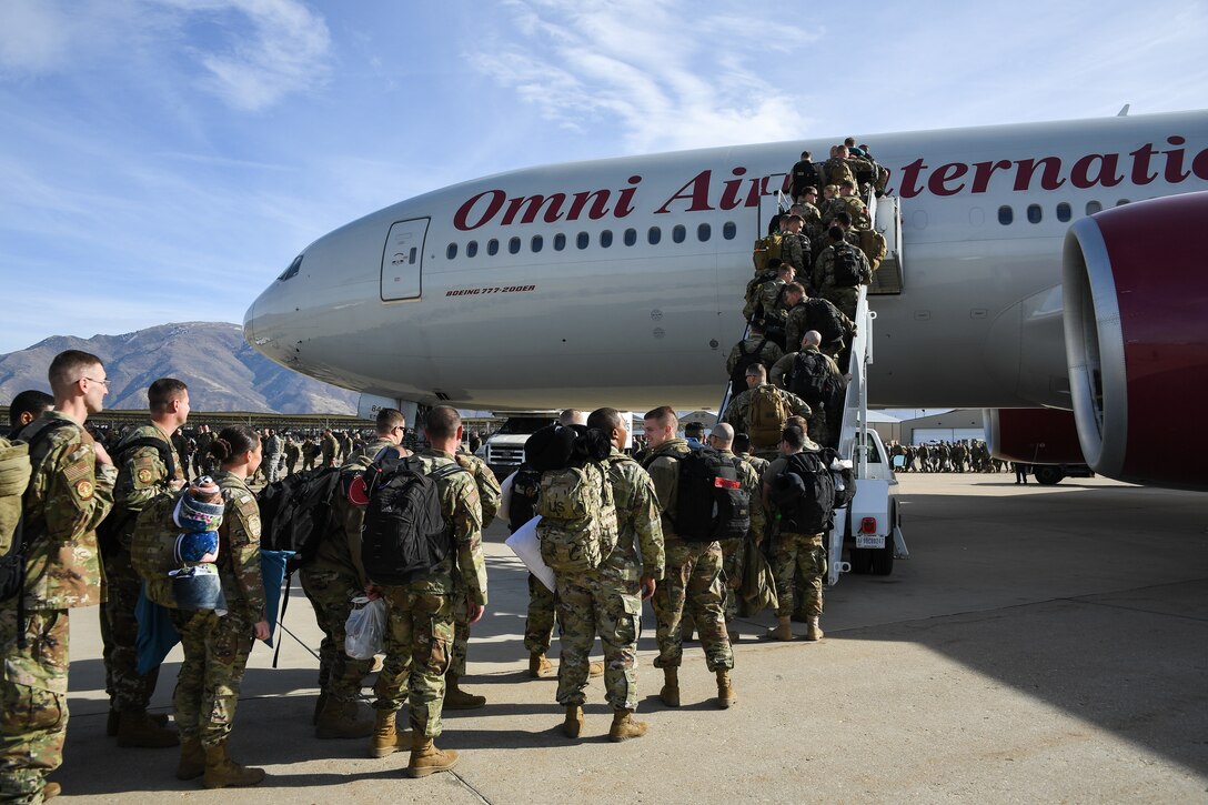 Photo of Airman boarding a plane.