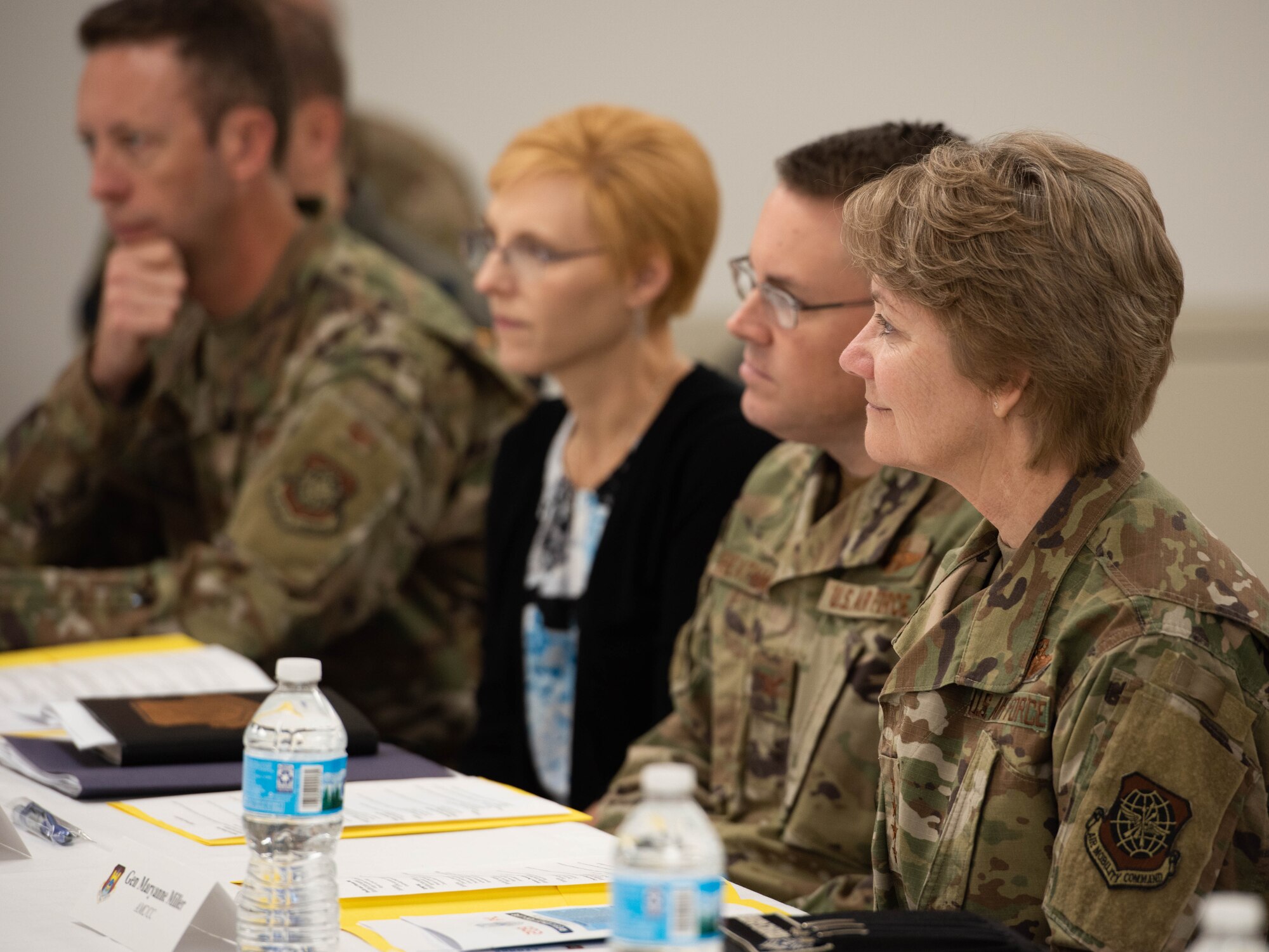Gen. Maryanne Miller, Air Mobility Command commander, and Col. J. Scot Heathman, 375th Air Mobility Wing commander, speak with representatives from various helping agencies at Scott Air Force Base, Ill., Nov. 18, 2019.