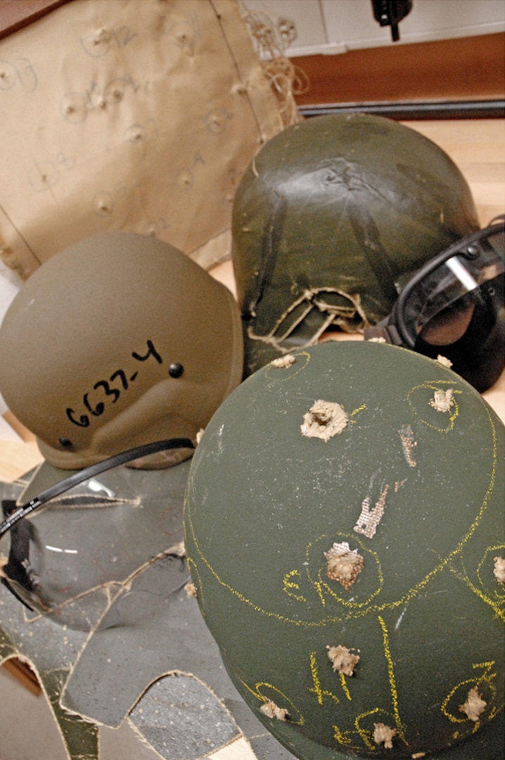 A batch of helmets sits on a table at the DLA Troop Support Product Test Center Analytical in Philadelphia after going through rigorous testing to ensure the material meets the prescribed specifications intended to keep military members safe.