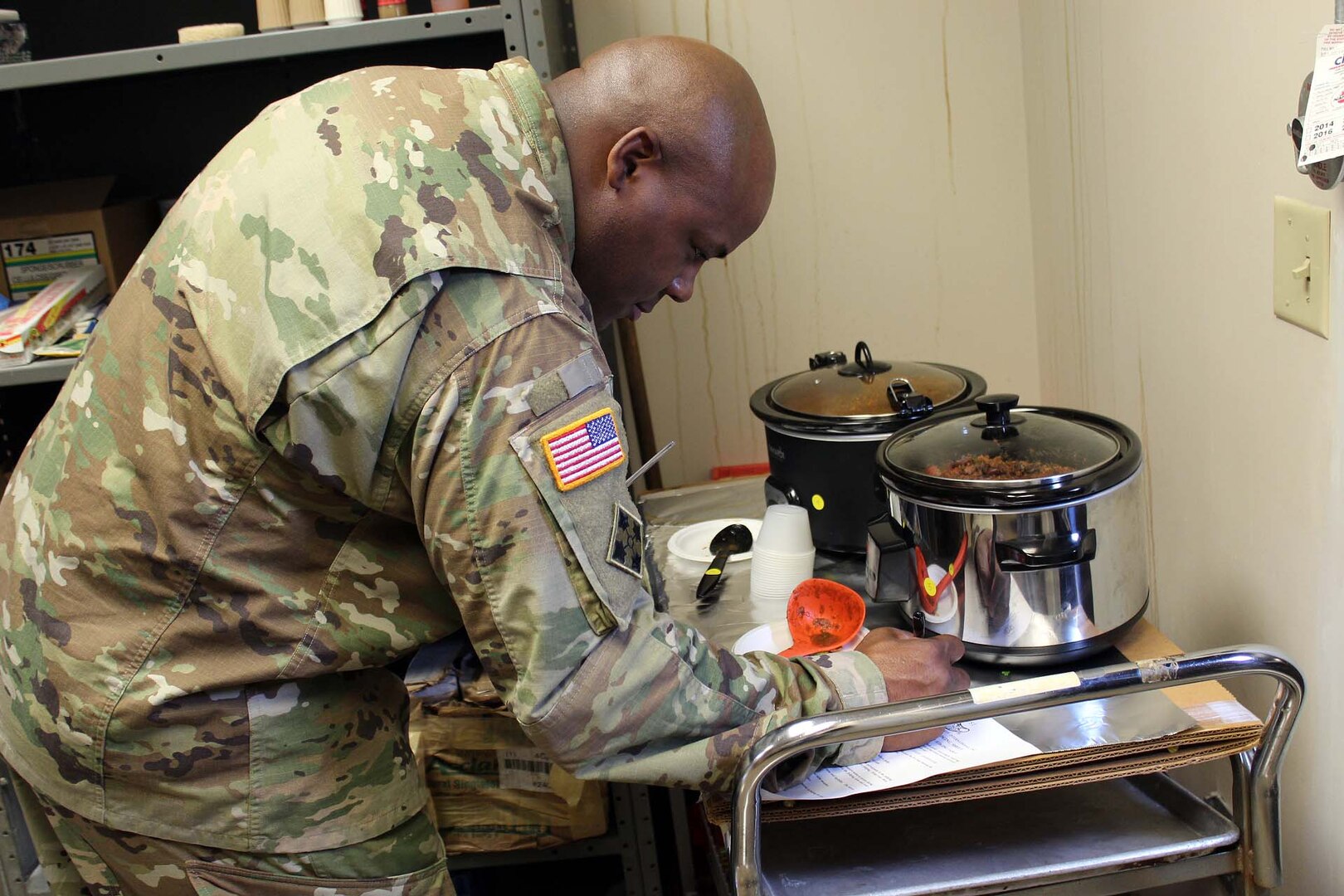 Army Maj. Lionel Macklin, program manager for combat feeding in the Subsistence supply chain at the Defense Logistics Agency Troop Support, judges samples during a workforce chili cook-off. The event, held at DLA Troop Support headquarters in Philadelphia, is an annual awareness event for the Combined Federal Campaign.