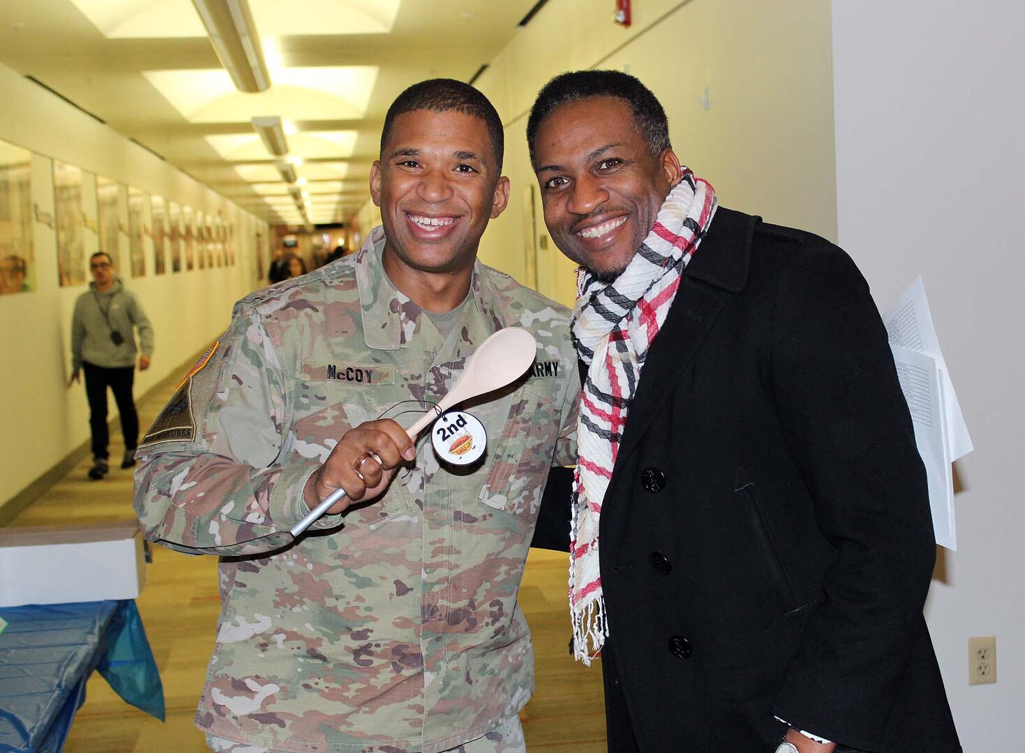 Army Col. Eric McCoy, left, director of the Subsistence supply chain at the Defense Logistics Agency Troop Support in Philadelphia, awards second place prize for the chili cook-off to John Lewis, a data architect in the Medical supply chain. The cook-off was held on Nov. 20 at DLA Troop Support headquarters in Philadelphia, and is an annual awareness event for the Combined Federal Campaign.