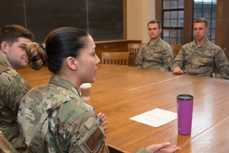 Capt. Jennifer Pierce (front), Chief of Public Affairs, 103rd Airlift Wing, speaks to cadets assigned to Air Force ROTC Detachment 009 at Yale University, during a panel discussion, November 14, 2019. The discussion was held to meet ROTC training objectives, which require cadets to gain exposure to the operational Air Force environment by interacting with active Air Force members. (U.S. Air National Guard photo by Tech. Sgt. Tamara R. Dabney)