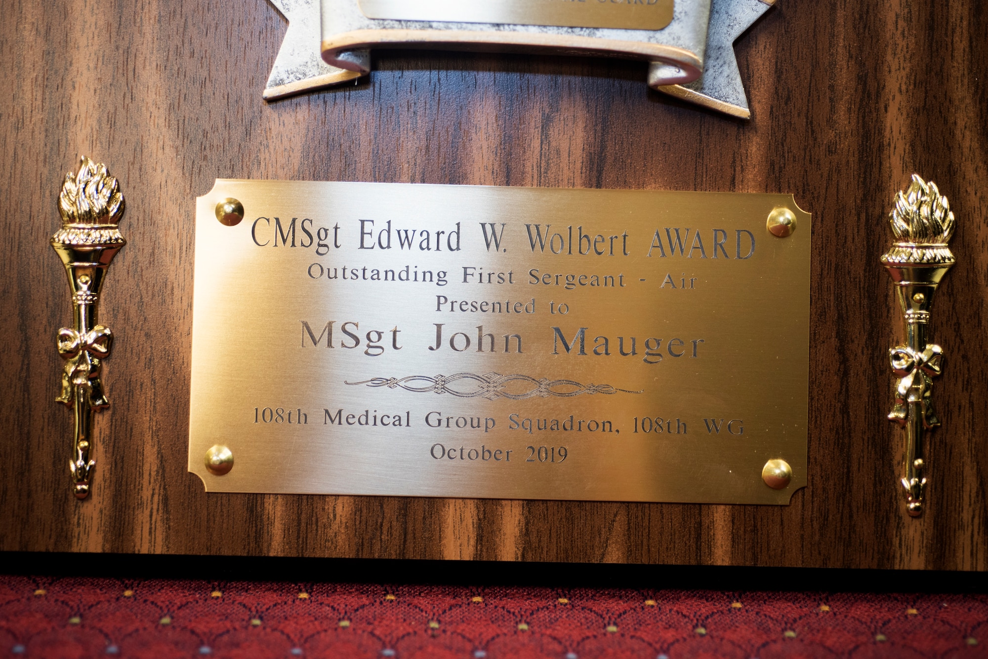 The Chief Master Sgt. Edward W. Wolbert Oustanding First Sergeant Award, given to Master Sgt. John Mauger, the 108th Medical Group first sergeant, sits in the headquarters building at Joint Base McGuire-Dix-Lakehurst, N.J., Nov. 17, 2019.  Mauger was selected as the award winner on Aug. 9, 2019 by the Enlisted Association of the National Guard of New Jersey. (U.S. Air National Guard photo by Senior Airman Julia Santiago)