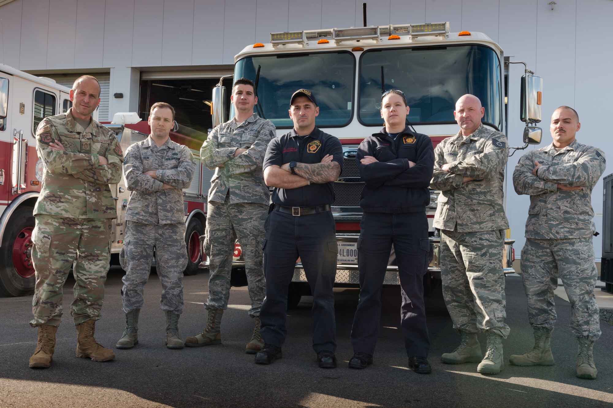 (From left to right) Chief Master Sgt. Robert Cross, Tech. Sgt. Craig Bein, Senior Airman Jason Conway, Firefighter Howard Corp, Firefighter Lisa Deakins, Tech. Sgt Ronald Avery, and Senior Airman Gabriel Pagan pose in front of the Bradley Air National Guard Base Fire Station Nov. 3, 2019 East Granby, Conn. These firefighters all responded to the B-17 Flying Fortress crash at Bradley International Airport Oct. 2, 2019. (U.S. Air National Guard photo by Airman 1st Class Chanhda Ly)