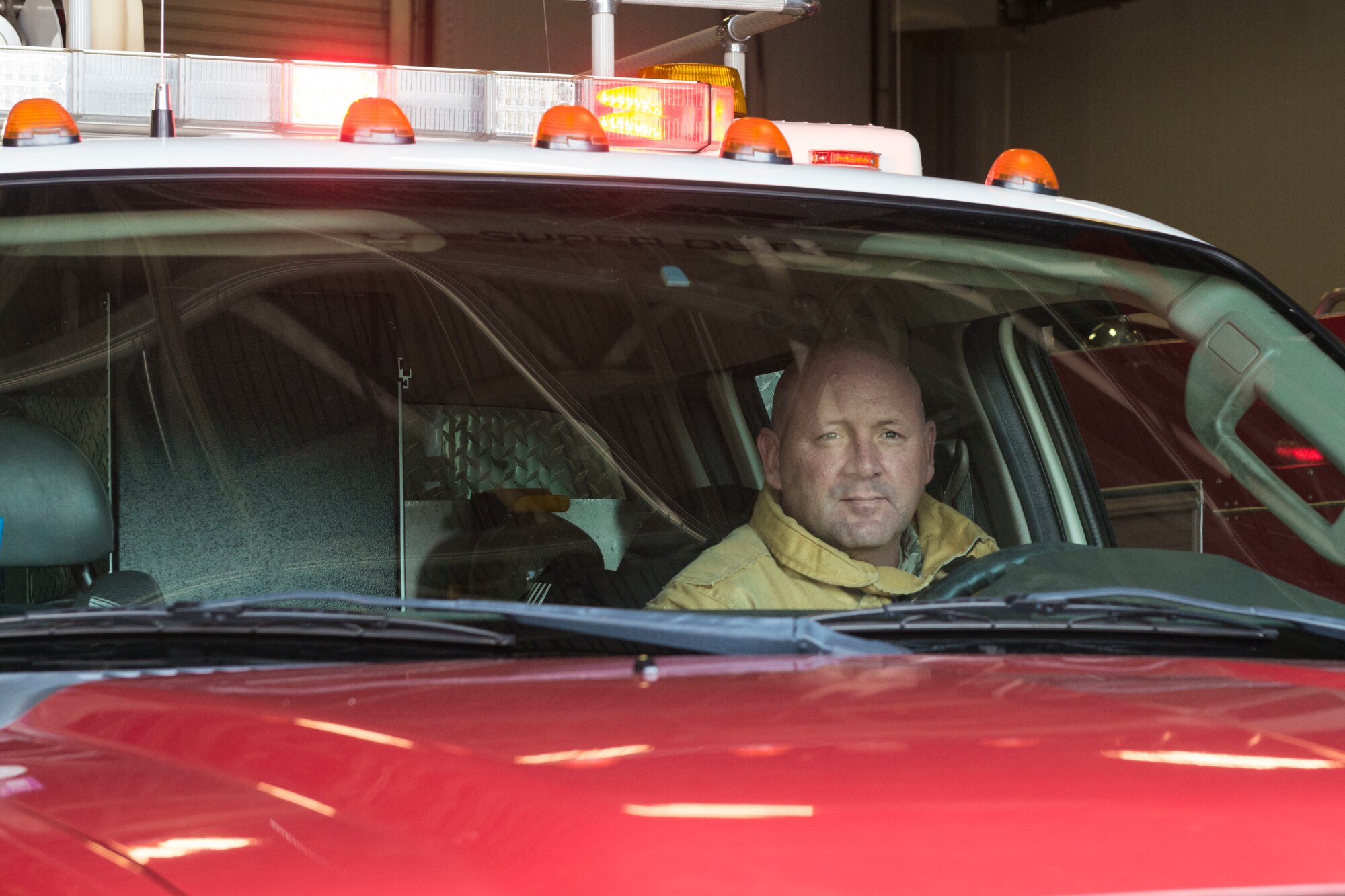 Tech. Sgt. Ronald Avery, Connecticut Air National Guard firefighter, prepares to drive the rescue truck from the Bradley Air National Guard Base Fire Station Nov. 3, 2019. Firefighters at Bradley train consistently with the firefighters with the Bradley International Airport Fire Department, which ultimately aided their quick stabilization of the B-17 Flying Fortress crash that occurred Oct. 2, 2019. (U.S. Air National Guard photo by Airman 1st Class Chanhda Ly)