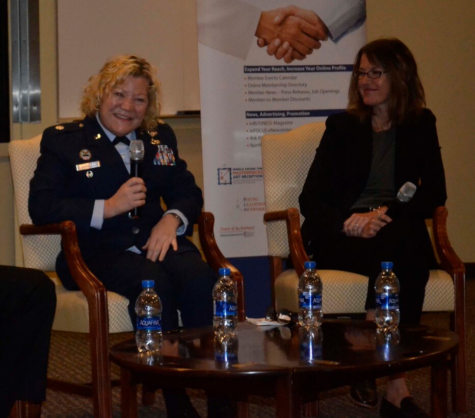 Air Force Reserve Lt. Col. Susan McMullen, DLA Troop Support Project Manager, left, sits beside FBI Special Agent Cerena Coughlin, right, as she shares her personal story of being a woman in the military during the Greater Northeast Philadelphia Chamber of Commerce annual Women in Industry Day event Nov. 20, 2019 at Holy Family University in Philadelphia. The Women in Industry Day event aims to “broaden the conversation” and expose women to various career opportunities. McMullen served as a panelist during the “women in male-dominated industries” discussion. (Photo by Alexandria Brimage-Gray)