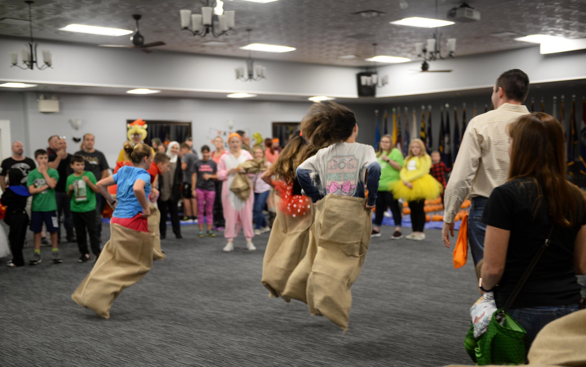 Participants race against each other in a game during Boo Fest at the Club Oct. 26, 2019, on Columbus Air Force Base, Miss. Halloween was brought to the U.S. by Irish and Scottish immigrants during the late 18th century to the early 19th century. (U.S. Air Force photo by Airman 1st Class Hannah Bean)