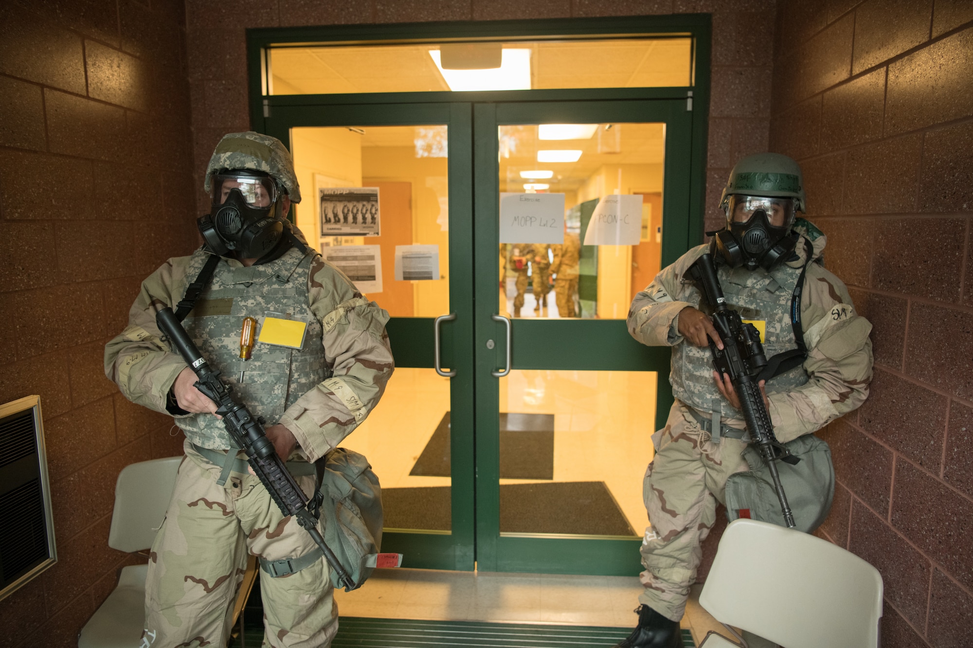 airmen in MOPP gear respond to a simulated threat