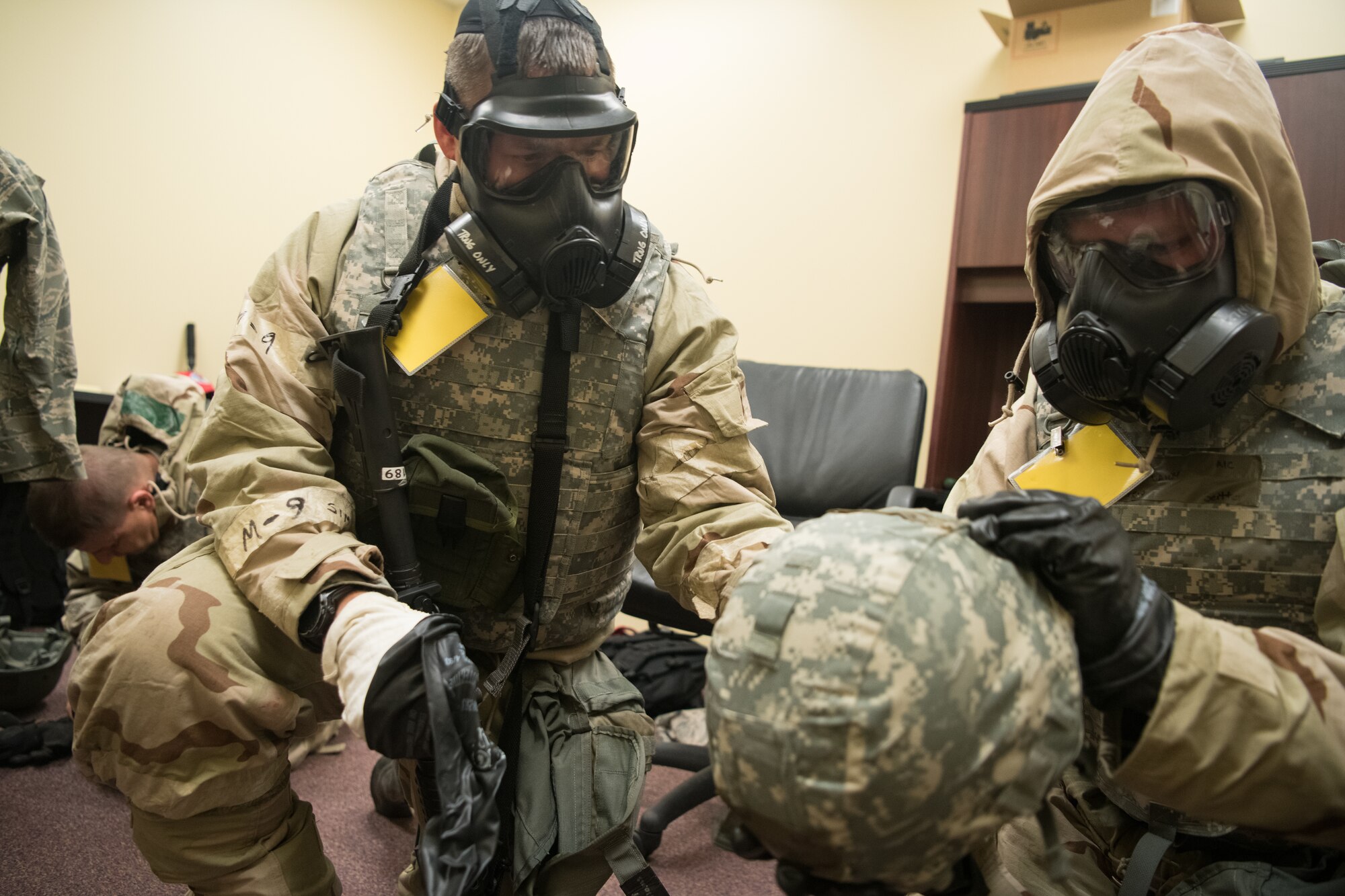 airmen in MOPP gear respond to a simulated threat