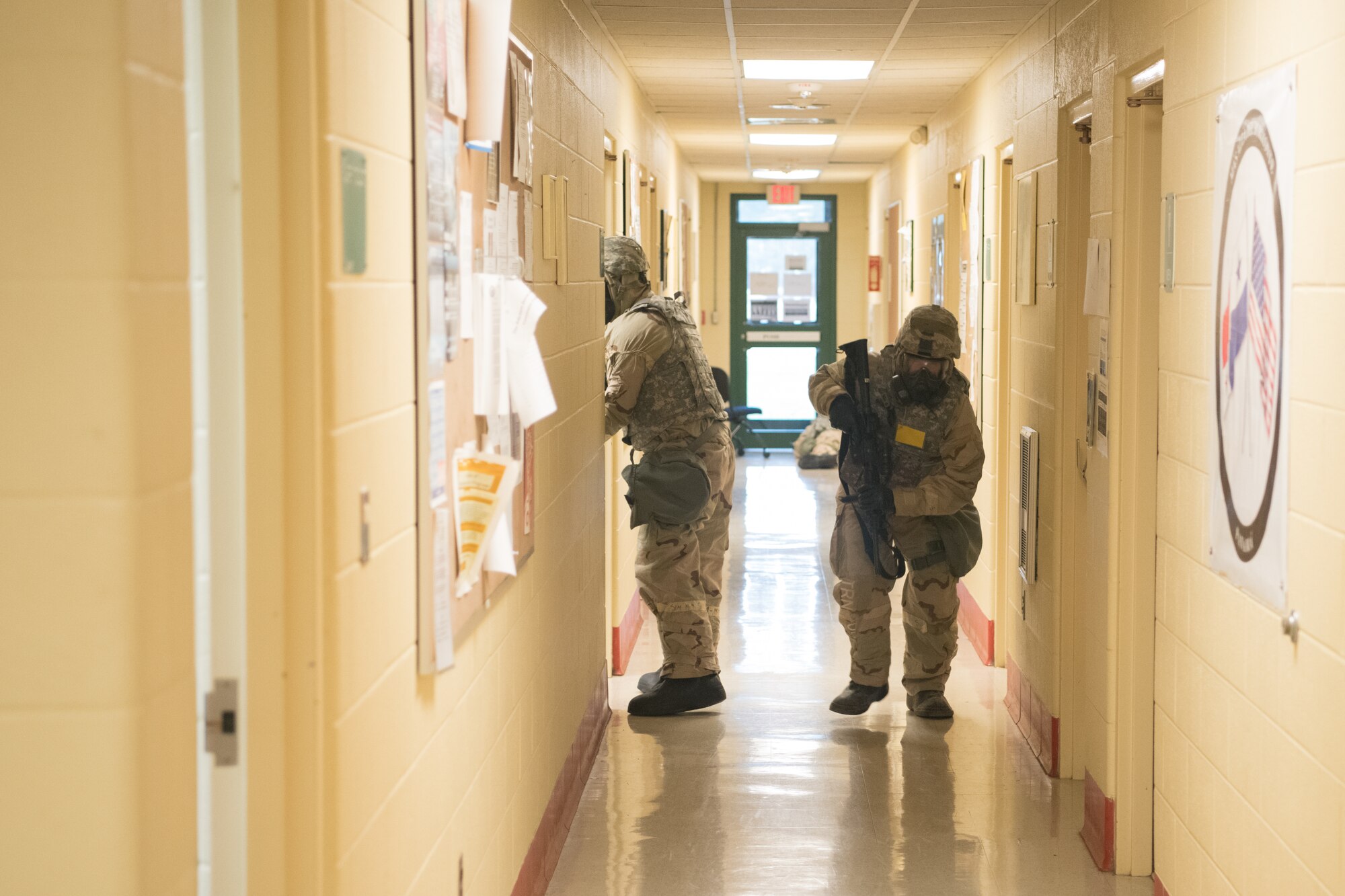 airmen in MOPP gear respond to a simulated threat