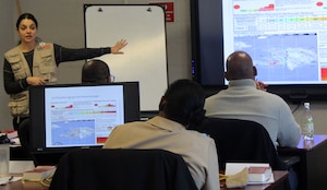 Nina Kessler, a U.S. Agency for International Development Office of U.S. Foreign Disaster Assistance humanitarian assistance advisor, speaks to a class during a Joint Humanitarian Operations Course at DLA Troop Support Nov. 13, 2019 in Philadelphia.