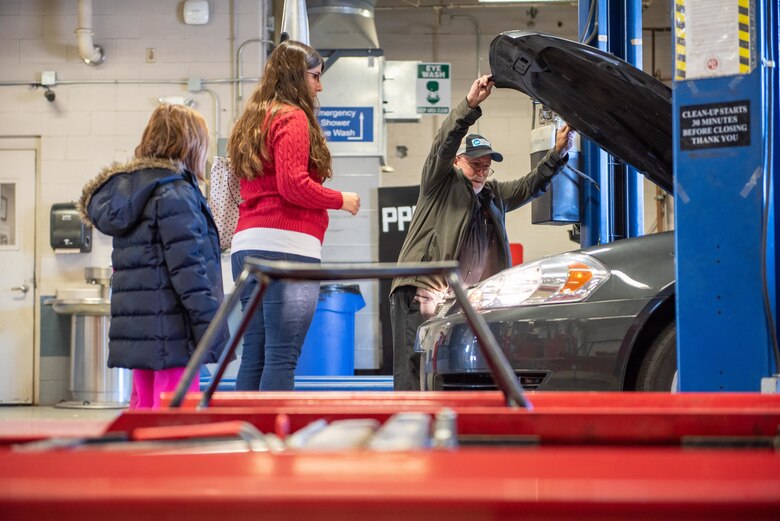 Billie Woods, 22nd Force Support Squadron Auto Shop mechanic, closes a car hood Nov. 19, 2019, at McConnell Air Force Base, Kan. Woods provided his expertise in winterizing vehicles to ensure less mechanically inclined driver’s cars are capable of typical winter conditions. (U.S. Air Force photo by Staff Sgt. Chris Thornbury)
