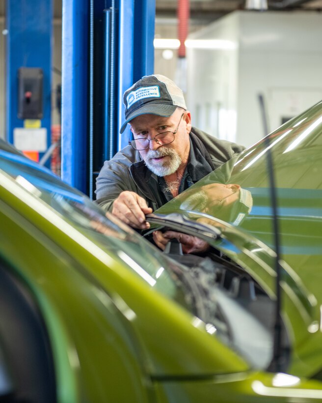 Billie Woods, 22nd Force Support Squadron Auto Shop mechanic, checks a windshield wiper Nov. 19, 2019, at McConnell Air Force Base, Kan. Woods inspected batteries, brakes, fluids, visors and lights then provided feedback and recommendations to less mechanically inclined drivers to give them confidence for the winter. (U.S. Air Force photo by Staff Sgt. Chris Thornbury)