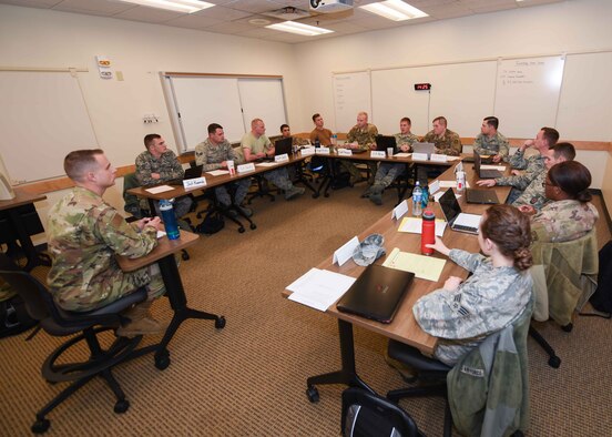 Airmen from the Airman Leadership School, discuss their personal development goals Nov. 19, 2019, at McConnell Air Force Base, Kan. The changes to the ALS curriculum make it more reliant on student research, problem solving and student-led discussions. (U.S. Air Force photo by Airman 1st Class Alexi Bosarge)