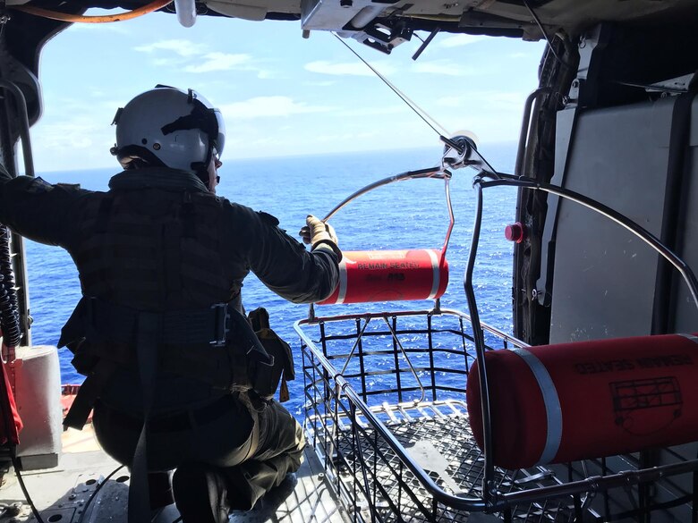 PACIFIC OCEAN (Nov. 20, 2019) Hospital Corpsman 1st Class Patrick Shea prepares to lower a rescue basket used as part of a medical evacuation mission conducted by the "Island Knights" of Helicopter Sea Combat Squadron (HSC) 25. A Chinese national in medical distress aboard the Chinese-flagged vessel Jin Bo was recovered approximately 100 miles northwest of Guam and flown to Guam Memorial Hospital for treatment. HSC-25 provides a multi-mission rotary wing capability for units in the U.S. 7th Fleet area of operations and maintains a Guam-based 24-hour search-and-rescue and medical evacuation capability, directly supporting U.S. Coast Guard and Joint Region Marianas. HSC-25 is the Navy’s only forward-deployed MH-60S expeditionary squadron.